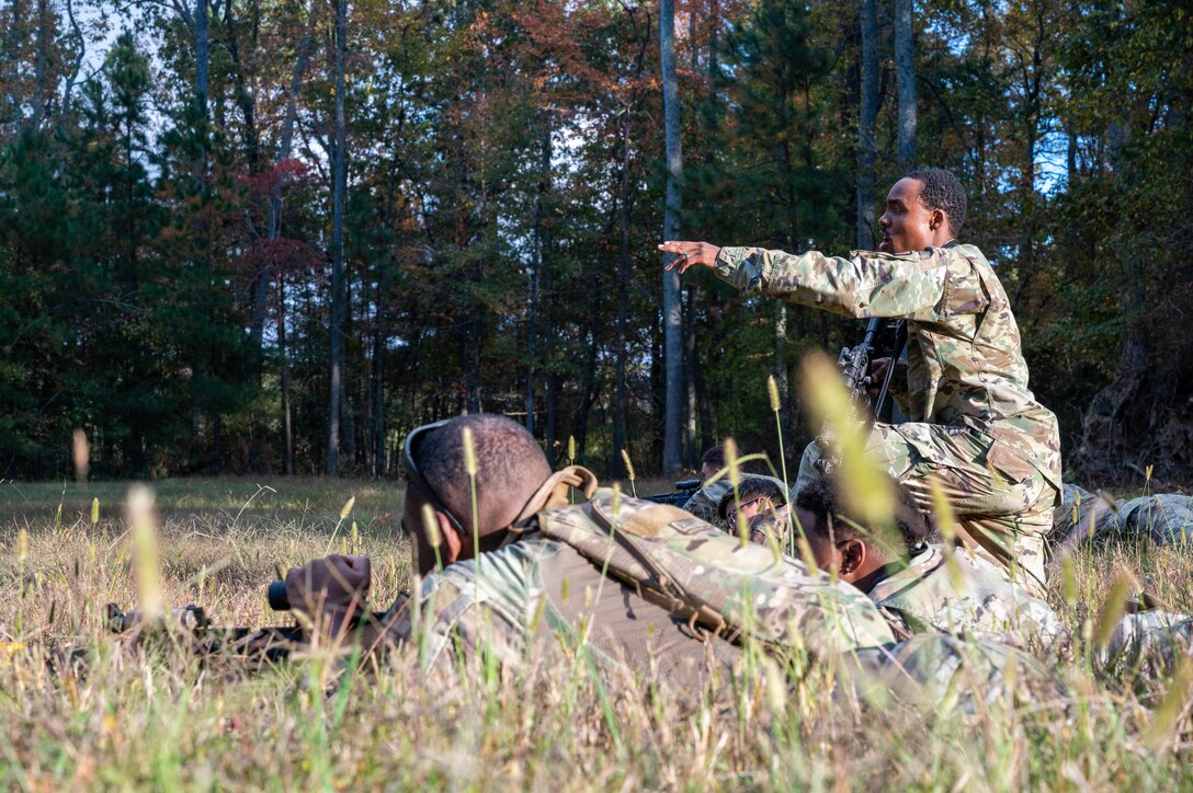 U.S. Air Force Tech. Sgt. Marcus Brown, 633d Security Forces Squadron flight sergeant, directs team alpha, bravo and charlie’s attack patterns during the SF field exercise at Joint Base Langley-Eustis, Virginia, Nov. 1, 2022.