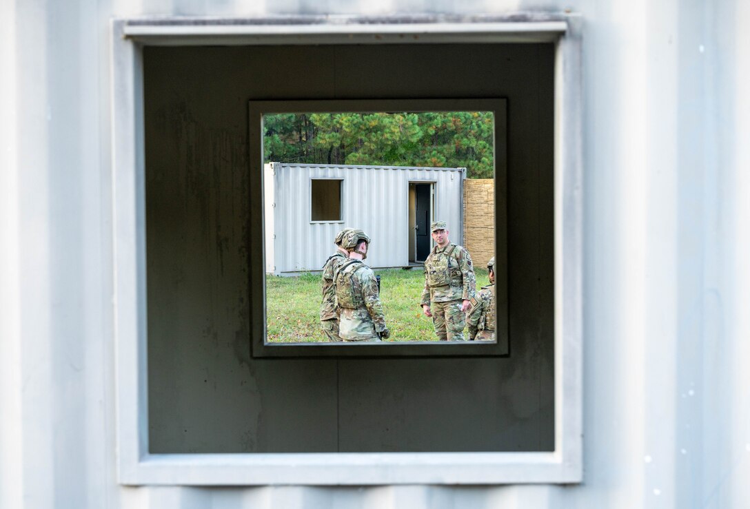 U.S. Air Force Master Sgt. Anthony Meadows, 633d Security Forces Squadron flight chief, offers feedback to Airmen during a field exercise at Joint Base Langley-Eustis, Virginia, Nov. 1, 2022.