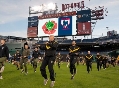 Service members from around the National Capital Region warm up for a circuit workout hosted by the Washington Nationals baseball team on Oct. 28, 2022, at Nationals Park in Washington, D.C. U.S. Air Force, Army, Navy and Marine Corps service members from around the National Capital Region participated in the event. (U.S. Air Force photo by Jason Treffry)