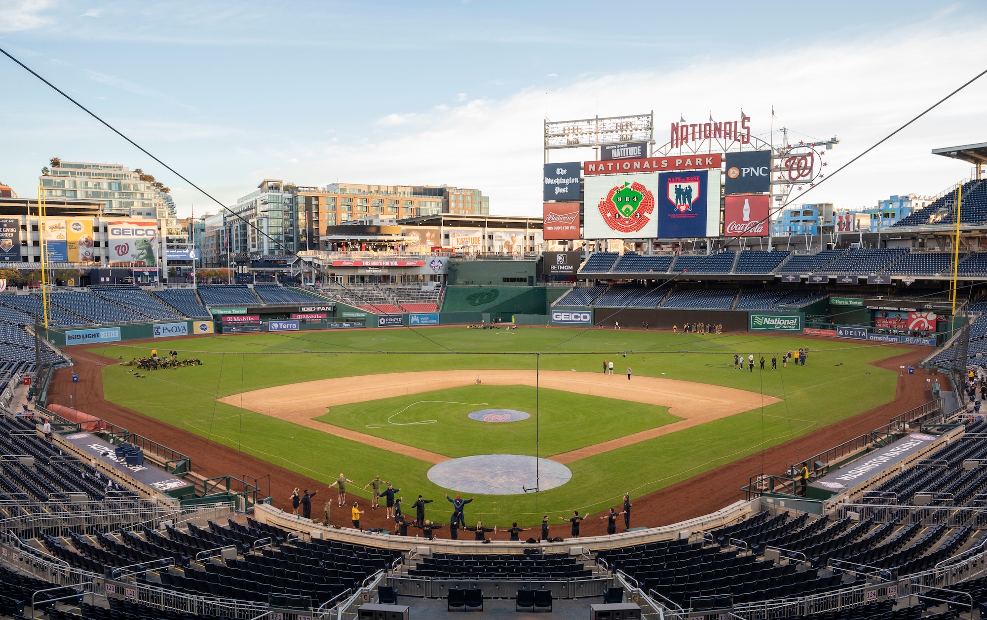 Service members from around the National Capital Region participate in a circuit workout hosted by the Washington Nationals baseball team on Oct. 28, 2022, at Nationals Park in Washington, D.C. The workout included multiple stations focused on various muscle groups located throughout the stands, dugouts and field. (U.S. Air Force photo by Jason Treffry)