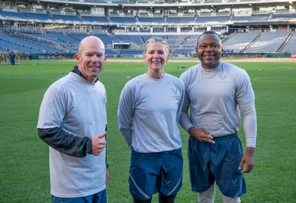 Vice commander U.S. Air Force Col. Ryan Zeitler, commander Col. Catherine “Cat” Logan and command chief Chief Master Sgt. Clifford Lawton, all assigned to Joint Base Anacostia-Bolling and the 11th Wing, pose for a photo between stations at a circuit workout hosted by the Washington Nationals baseball team on Oct. 28, 2022, at Nationals Park in Washington, D.C. JBAB strives to engage in events with the community to create partnerships throughout the National Capital Region. (U.S. Air Force photo by Jason Treffry)