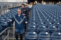 U.S. Air Force Col. Catherine “Cat” Logan, commander of Joint Base Anacostia-Bolling and the 11th Wing, runs down the stands during a circuit workout hosted by the Washington Nationals baseball team on Oct. 28, 2022, at Nationals Park in Washington, D.C. U.S. Air Force, Army, Navy and Marine Corps service members from around the National Capital Region participated in the event. (U.S. Air Force photo by Jason Treffry)