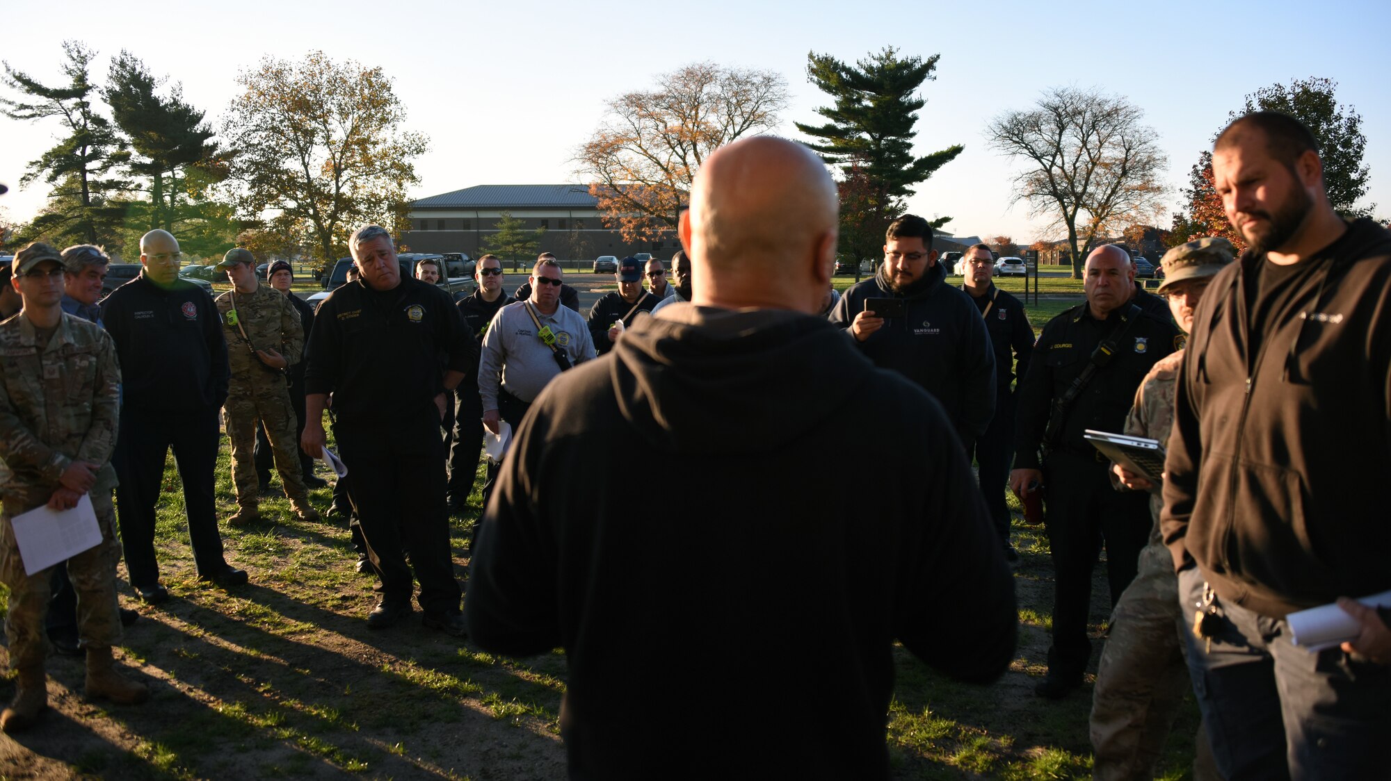 A class instructor lectures participants during training.