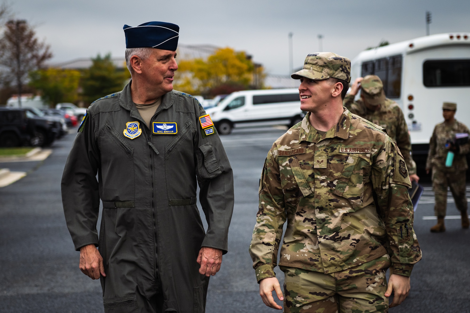 U.S. Air Force Gen. Mike Minihan, Air Mobility Command commander, and Senior Airman Austin Sondergard, 305th Air Mobility Wing crew chief, discuss Sondergard’s recovery from brain surgery at Joint Base McGuire-Dix-Lakehurst, N.J., Nov. 1, 2022.
