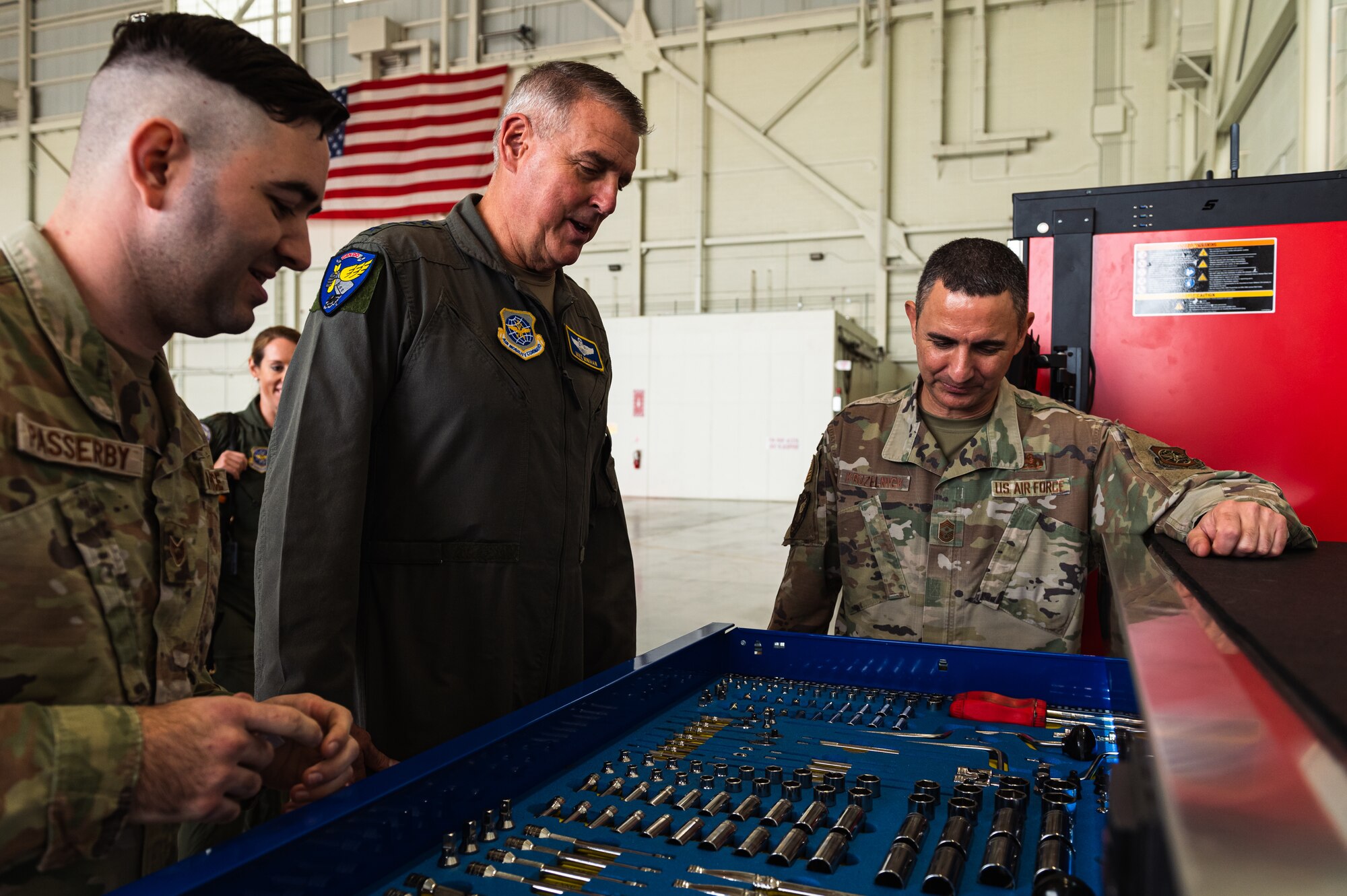 U.S. Air Force Gen. Mike Minihan, Air Mobility Command commander, and Chief Master Sgt. Brian Kruzelnick, AMC command chief, receive a hands-on smart toolbox demonstration from an Airman assigned to the 305th Air Mobility Wing at Joint Base McGuire-Dix-Lakehurst, N.J., Nov. 1, 2022.