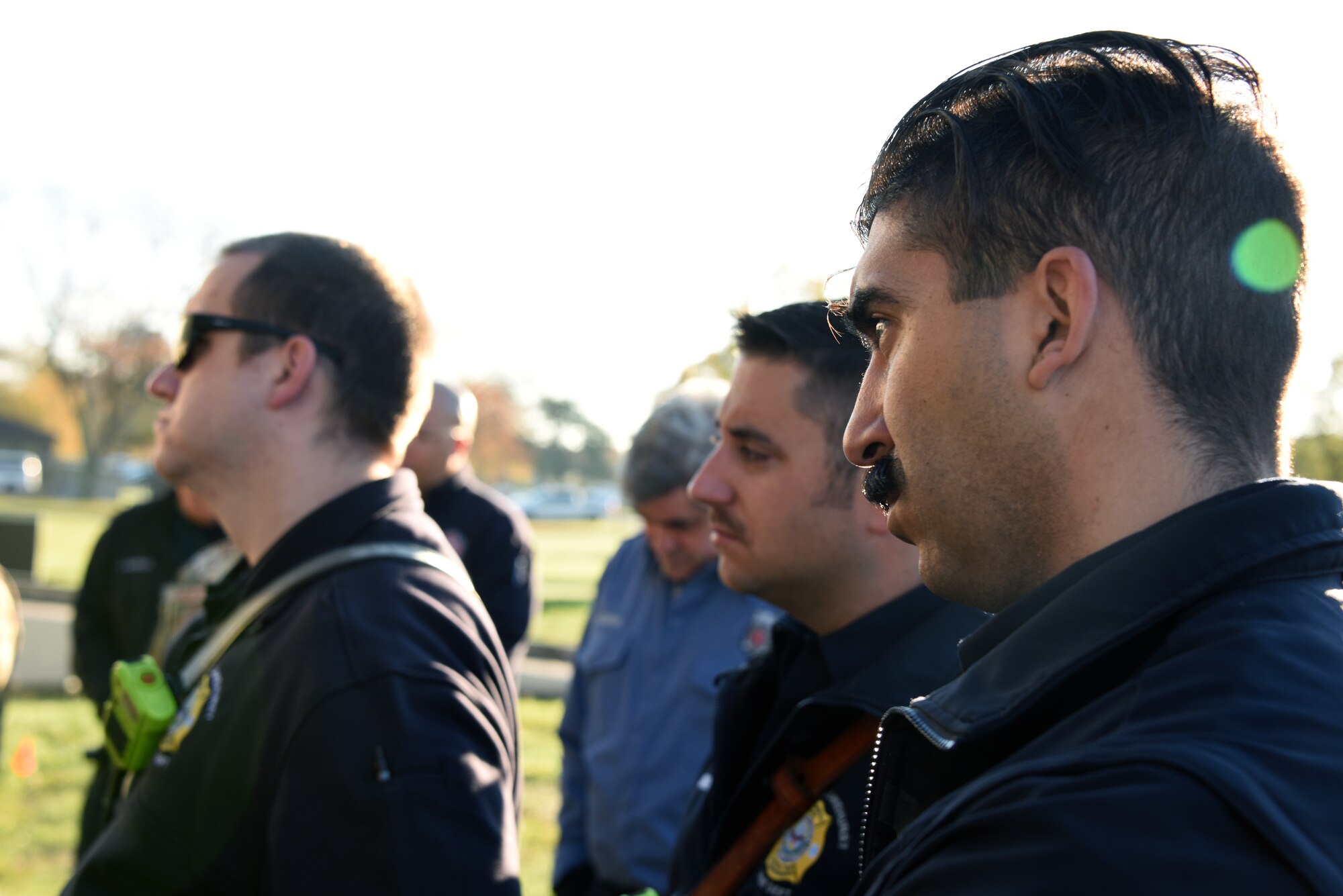 Participants listen to class instructors during training.