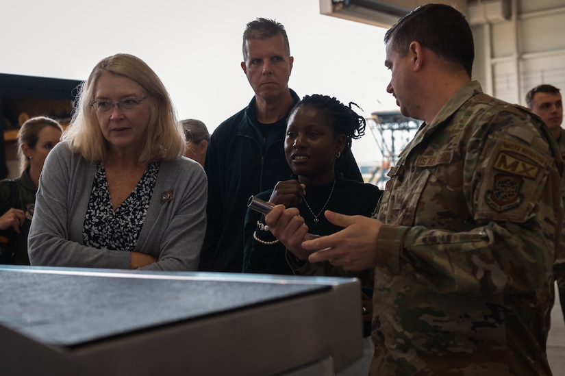 Ashley Minihan, spouse of Gen. Mike Minihan, Air Mobility Command commander, and Kareen Kruzelnick, spouse of Chief Master Sgt. Brian Kruzelnick, AMC command chief, receive a hands-on smart toolbox demonstration at Joint Base McGuire-Dix-Lakehurst, N.J., Nov. 1, 2022.