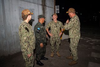Capt. Kathryn S. Elliott, from left, commanding officer of the Medical Treatment Facility aboard the hospital ship USNS Comfort (T-AH 20), Honduran navy Capt. Juan De Jesus, deputy commodore for Amphibious Squadron (PHIBRON) 4, Rear Adm. Douglas W. Sasse, III, Reserve Vice Commander, U.S. 4th Fleet, and Capt. Bryan Carmichael, commodore of PHIBRON 4, meet after the ship arrived for Continuing Promise 22 in Puerto Cortes, Honduras, Nov. 3, 2022. Comfort is deployed to U.S. 4th Fleet in support of CP22, a humanitarian assistance and goodwill mission conducting direct medical care, expeditionary veterinary care, and subject matter expert exchanges with five partner nations in the Caribbean, Central and South America