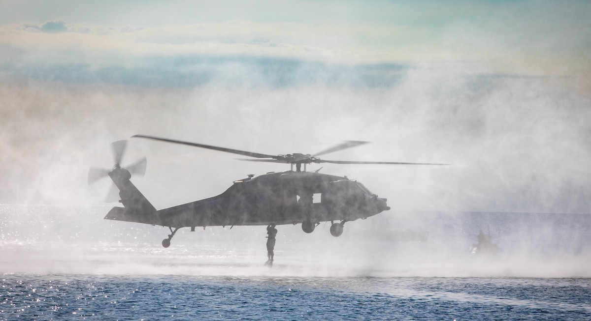 Naval Aircrewman 3rd Class Cristian Ortiz, assigned to the "Chargers" Helicopter Sea Combat Squadron (HSC) 26 onboard the hospital ship USNS Comfort (T-AH 20), jumps from an MH60S Seahawk during a search and rescue exercise at Puerto Cortes Naval Base in Puerto Cortes, Honduras, Nov. 4, 2022.