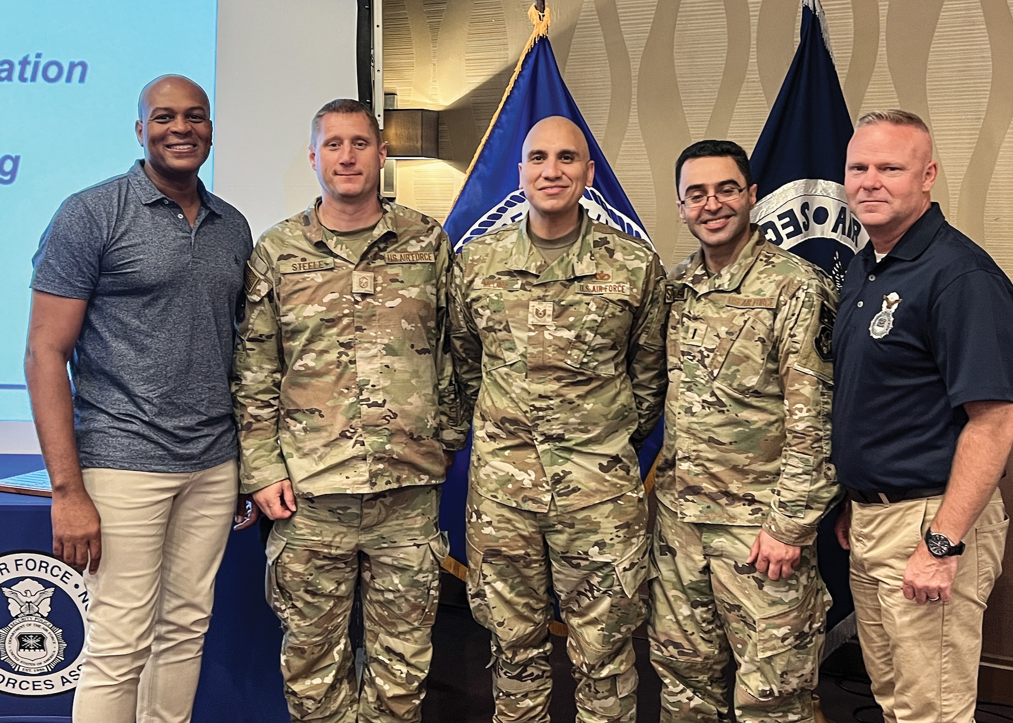 (from left) Brig. Gen. Roy W. Collins, director of security forces, deputy chief of staff for logistics, engineering and force protection; Master Sgt. Ryan Steele; Tech. Sgt. Julio Medina; 1st Lt. Bilal Temsah; and Chief Master Sgt. Donald S. Gallagher, security forces career field manager, pose for a photo during the Air Force Security Forces Association national meeting in Dayton, Ohio, Sept. 21-25, 2022.