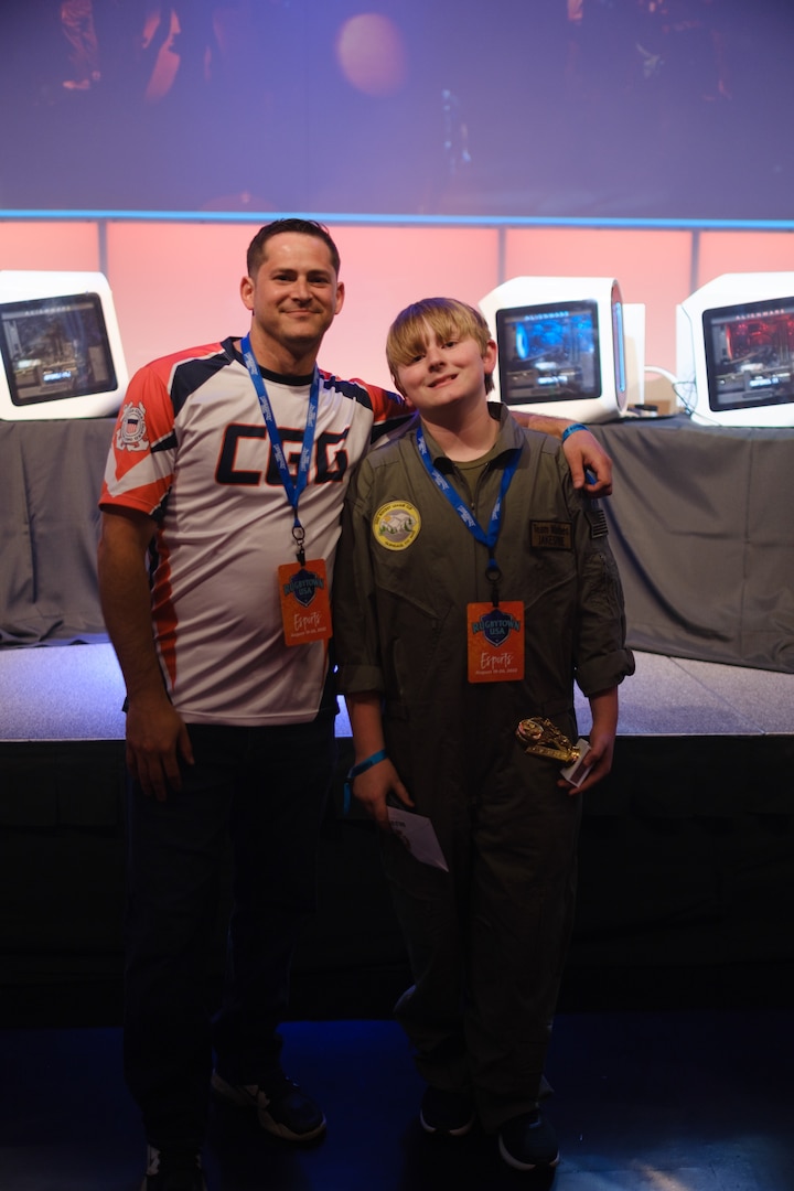 Petty Officer 1st Class Alex “Gambit” Alfonso, an information systems technician stationed at Electronic Support Detachment Baltimore, and Christian “Jakespine” Jacobs, a Gold Star Gamer Marine team member, pose for a photo at Infinity Park in Glendale, Colorado, August 19, 2022. Alfonso is a member of the Coast Guard Gaming team that competed in the Warrior GMR Foundation’s Rocket League tournament and helped coach the Marine GSG team during the children’s league. (U.S. Coast Guard photo by Petty Officer 2nd Class Jasmine Mieszala)