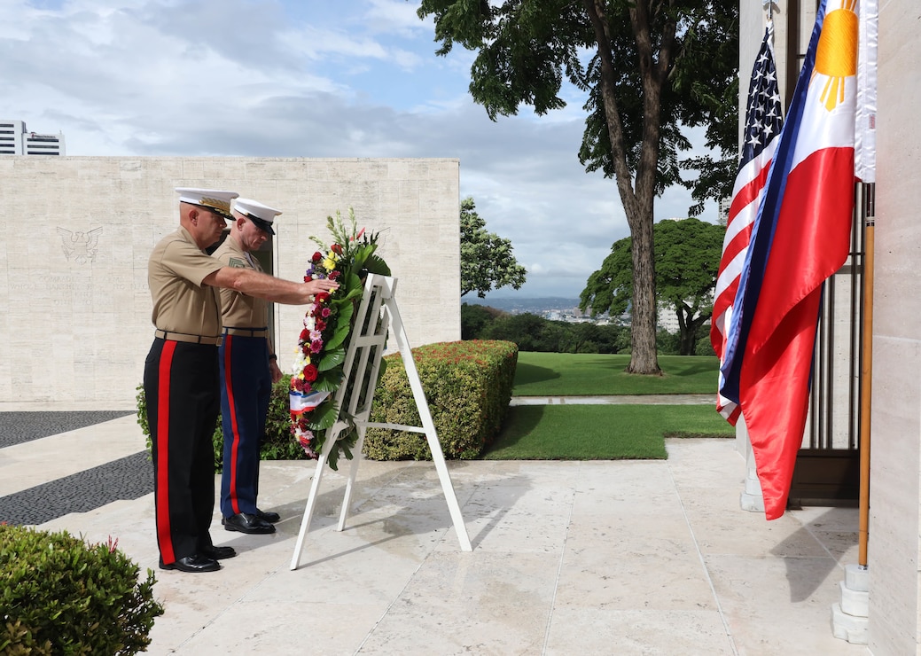 The 38th Commandant of the U.S. Marine Corps, General David H. Berger, and the 19th Sergeant Major of the U.S. Marine Corps, Sgt. Maj. Troy E. Black, take part in a wreath-laying ceremony at the Manila American Cemetery and Memorial, Manila, Philippines, Sept. 5, 2022. The ceremony honored the lives lost during the Pacific Theater of WWII. (U.S. Marine Corps Photo by Sgt. Kathryn Adams)