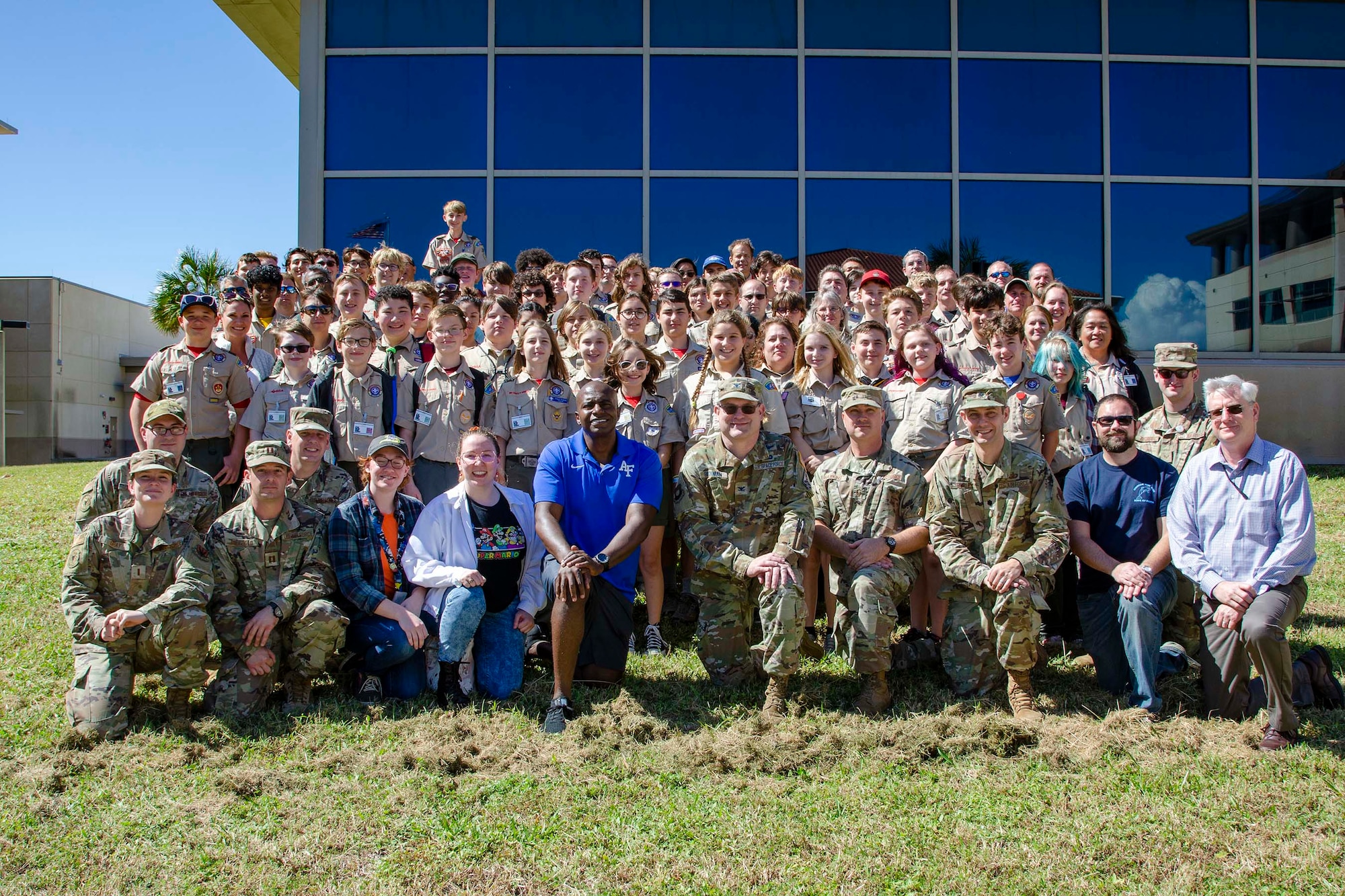 A group of 62 Boy Scouts and their Troop Leaders from across Central Florida pose with members of the Air Force Technical Applications Center Oct. 22, 2022, after earning the coveted Nuclear Science Merit Badge.  AFTAC, the sole nuclear treaty monitoring center in the Department of Defense, hosts the merit badge event each year to help the boys and girls learn more about nuclear science. (U.S. Air Force photo by Susan A. Romano)