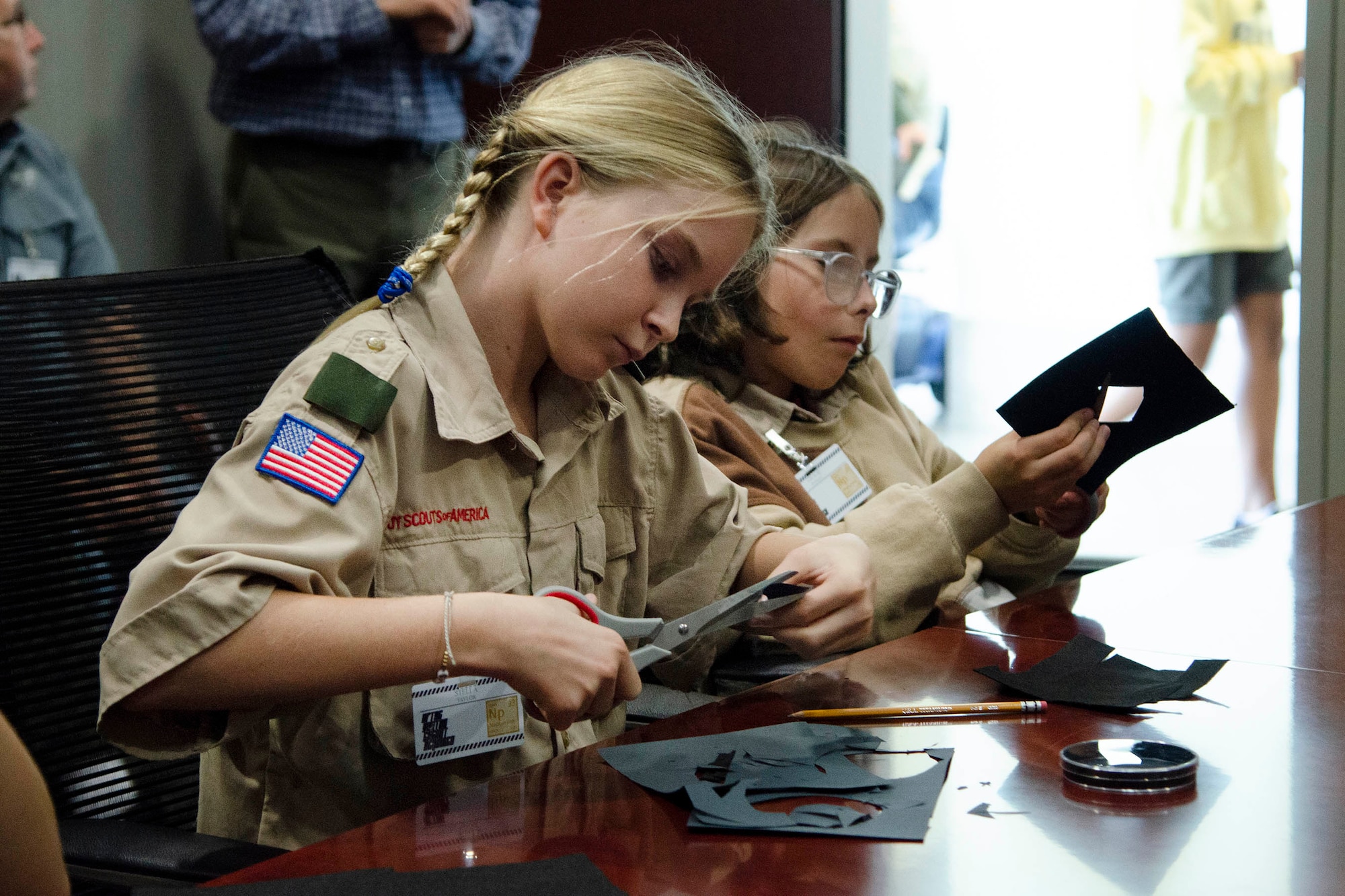 Stella Taylor, a 6th grader at Ormond Beach Middle School, cuts out a circle of felt to use in her cloud chamber as part of the process to earn the Nuclear Science Merit Badge.  Taylor was one of 62 scouts who traveled to the Air Force Technical Applications Center Oct. 22, 2022, to learn about nuclear science from experts in the field.  (U.S. Air Force photo by Susan A. Romano)