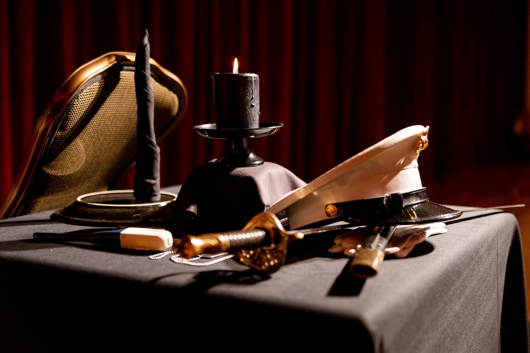 The fallen comrade table is displayed for attendees during the III Marine Expeditionary Force Information Group celebration of the 247th Marine Corps birthday on Camp Hansen, Okinawa, Japan, Nov. 3, 2022. A ceremonial ball is held every year to celebrate the Marine Corps birthday. During the ball, Marines across the globe reflect on their legacy and honor the fallen.
