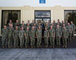 HICKAM (Oct. 25, 2022) -- Rear Adm. Jeff Jablon, Commander, Submarine Force, U.S. Pacific Fleet, bottom row, center, poses for a photo with submarine force leadership in front of Lockwood Hall during Group and Major Commanders’ Officer Training Symposium (GAMCOTS), Oct. 25. (U.S. Navy photo by Electronics Technician 2nd Class Leland T. Hasty II)