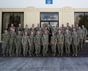 HICKAM (Oct. 25, 2022) -- Rear Adm. Jeff Jablon, Commander, Submarine Force, U.S. Pacific Fleet, bottom row, center, poses for a photo with submarine force leadership in front of Lockwood Hall during Group and Major Commanders’ Officer Training Symposium (GAMCOTS), Oct. 25. (U.S. Navy photo by Electronics Technician 2nd Class Leland T. Hasty II)