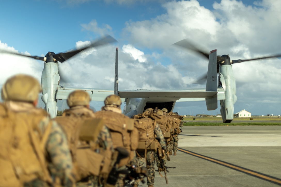 U.S. Marines with 3d Littoral Combat Team, 3d Marine Littoral Regiment, 3d Marine Division, load an MV-22B Osprey attached to Marine Aircraft Group 24, 1st Marine Aircraft Wing, as part of exercise Bougainville II at Marine Corps Base Hawaii, Oct. 25, 2022. A company with 3d Littoral Combat team secured an expeditionary advanced base at Dillingham Airfield in order to enable early warning of air and missile threats. Bougainville II is a field exercise that allows the MLR and its subordinate units to conduct expeditionary advanced base operations across the island of Oahu. BVII displays the MLR’s ability to rapidly establish and displace EABs while executing command and control in a dispersed environment. (U.S. Marine Corps photo by Sgt. Israel Chincio)