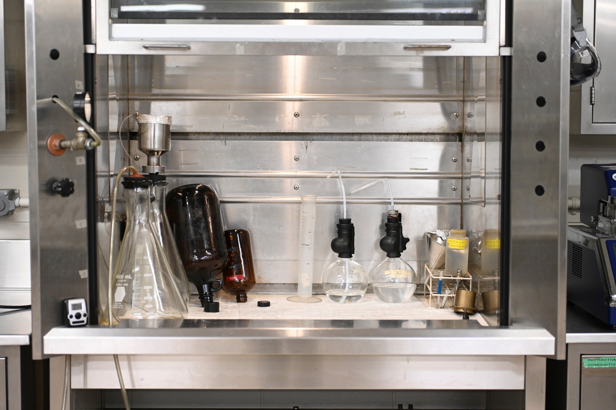 A photo of what looks sort of like a conventional oven with fuel equipment in it.
