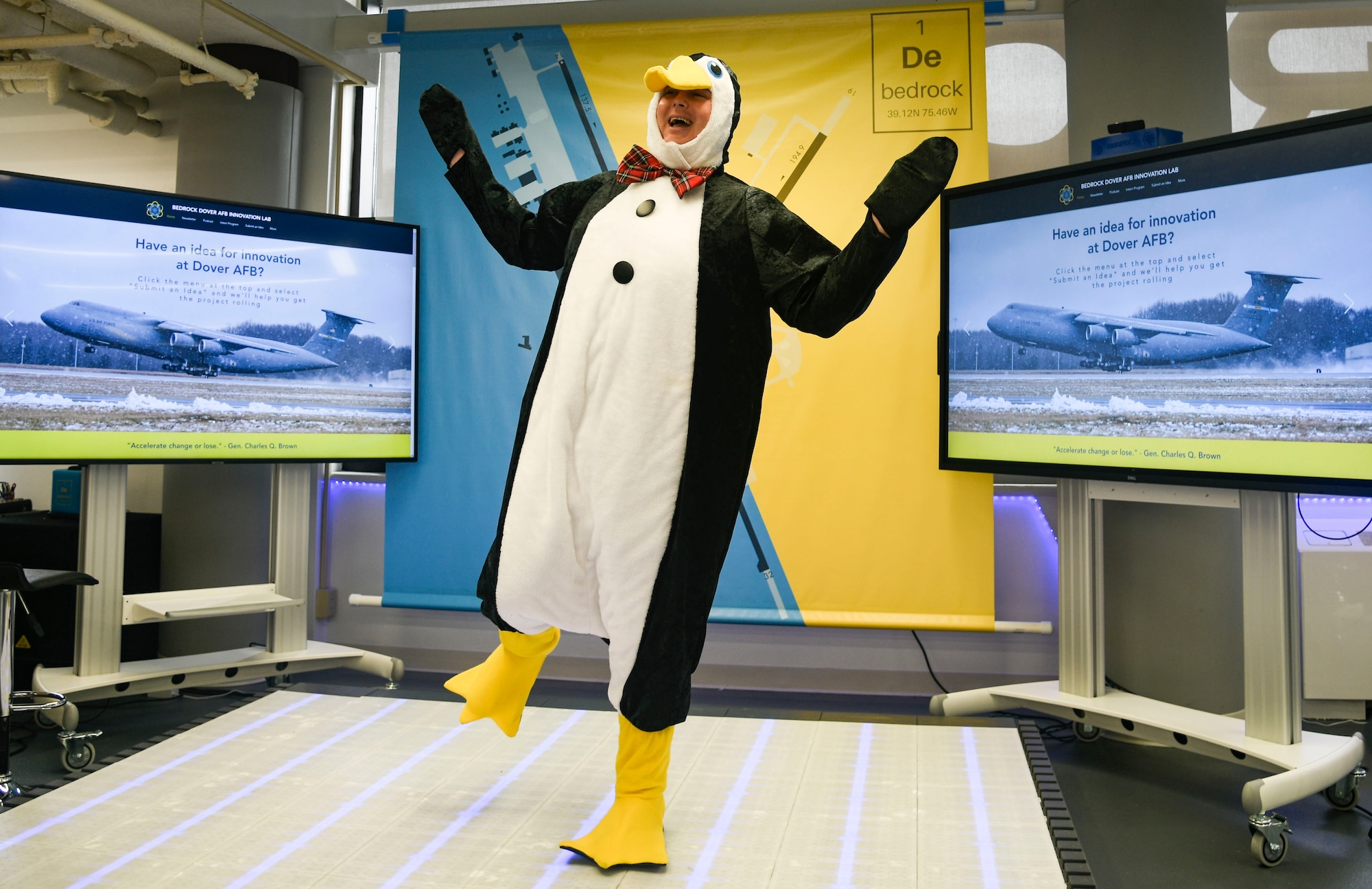 Maj. Nicholas Martini, 436th Airlift Wing chief innovation officer, makes his snowfall prediction in a penguin costume at the Bedrock Innovation Lab on Dover Air Force Base, Delaware, Oct. 31, 2022. Martini, a native of Cleveland, Ohio, predicted Dover AFB's first snowfall of a quarter-inch or greater will occur Dec. 29, 2022. (U.S. Air Force photo by Senior Airman Joshua LeRoi)