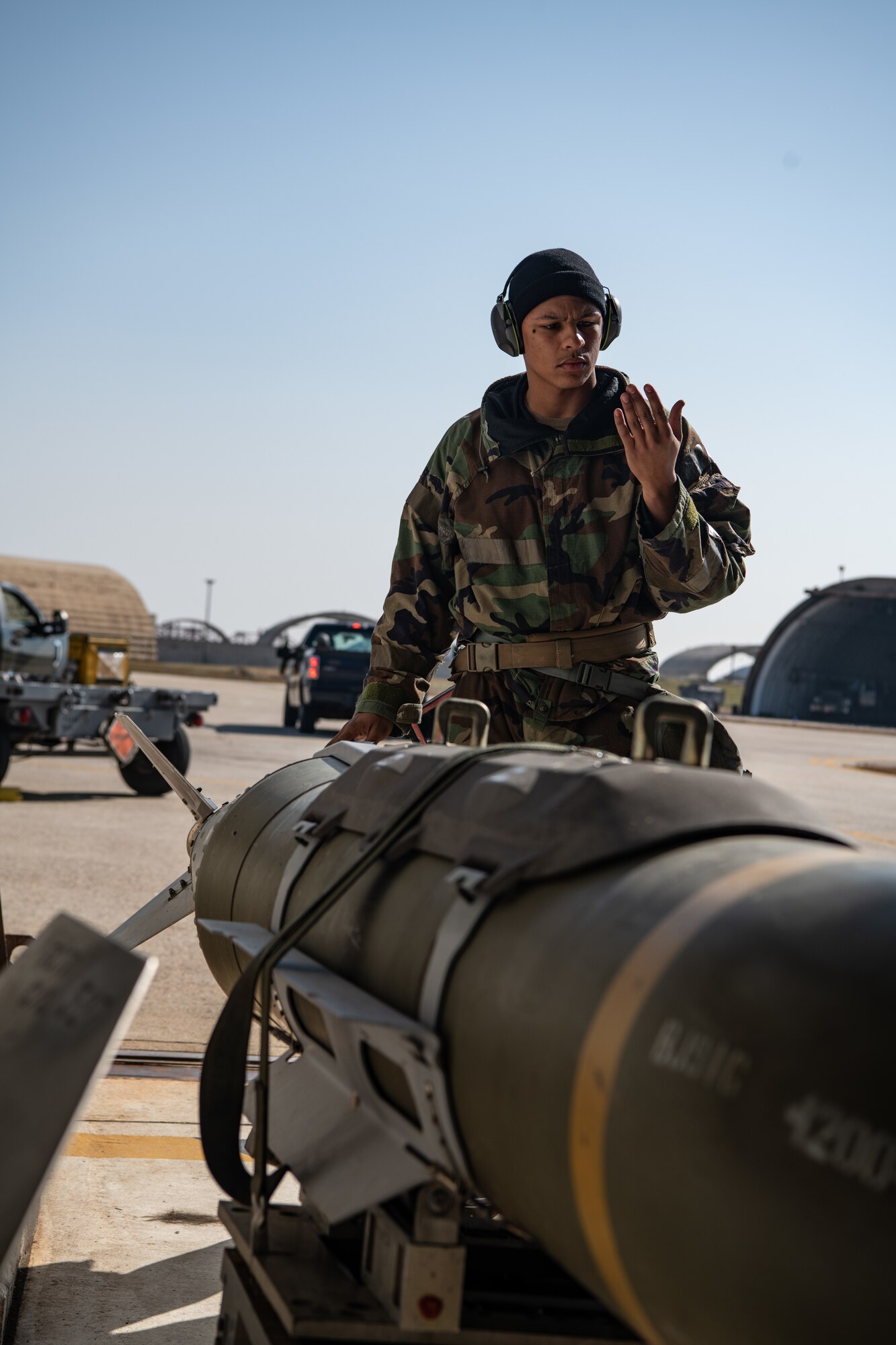 U.S. Air Force Staff Sgt. Tristan Bowen, 80th Fighter Generation Squadron weapons load crewmember, assists in the loading of a guided-bomb unit-31 (GBU-31) at Kunsan Air Base, Republic of Korea, Nov. 2, 2022.