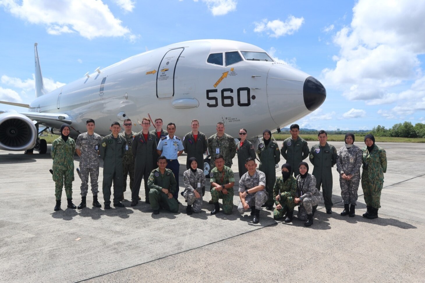 221026-N-FY142-0001 RIMBA AIR BASE, Brunei (Oct. 26, 2022) –  Members of Combat Aircrew 9, assigned to the “Red Lancers” of Patrol Squadron (VP) 10, pose for a photo in front of a static display with Commander Operations Group of the Royal Brunei Air Force Colonel Hishamuddin bin Abidin during Cooperation Afloat Readiness and Training Brunei 2022. VP-10 is currently operating from Kadena Air Base in Okinawa, Japan. The squadron conducts maritime patrol and reconnaissance, as well as theater outreach operations, as part of a rotational deployment to the U.S. 7th Fleet area of operations. (U.S. Navy photo by Lt. Samantha Michel)