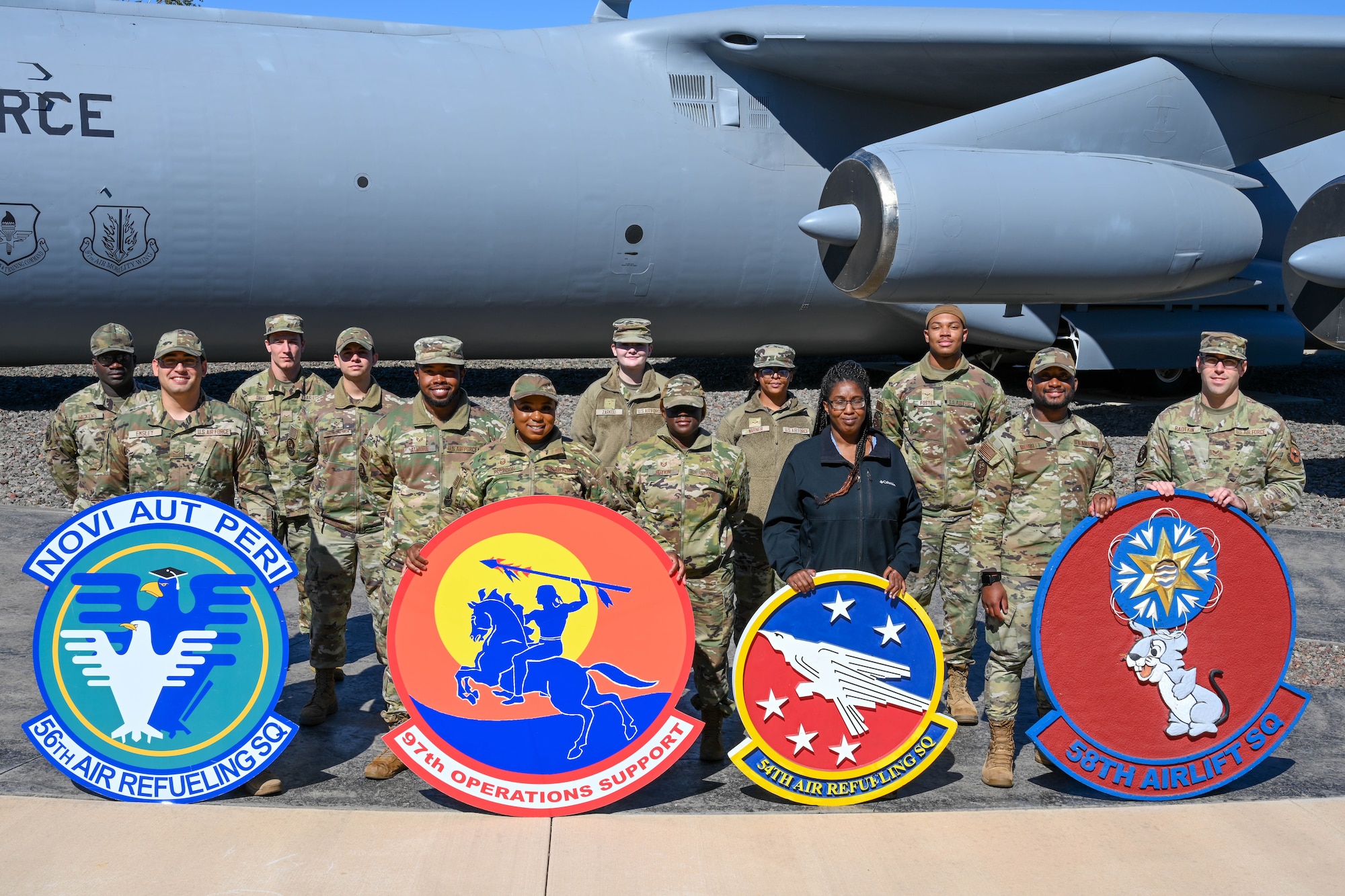 Airmen from the 97th Air Mobility Wing’s Squadron Aviation Resource Management (SARM) and Host Aviation Resource Management (HARM) offices pose for a photo at Altus Air Force Base, Oklahoma, Oct. 26, 2022. Each individual flying squadron at Altus Air Force Base, Oklahoma, has their own SARM office, while the HARM office oversees each aircrew member on base. (U.S. Air Force photo by Senior Airman Trenton Jancze)