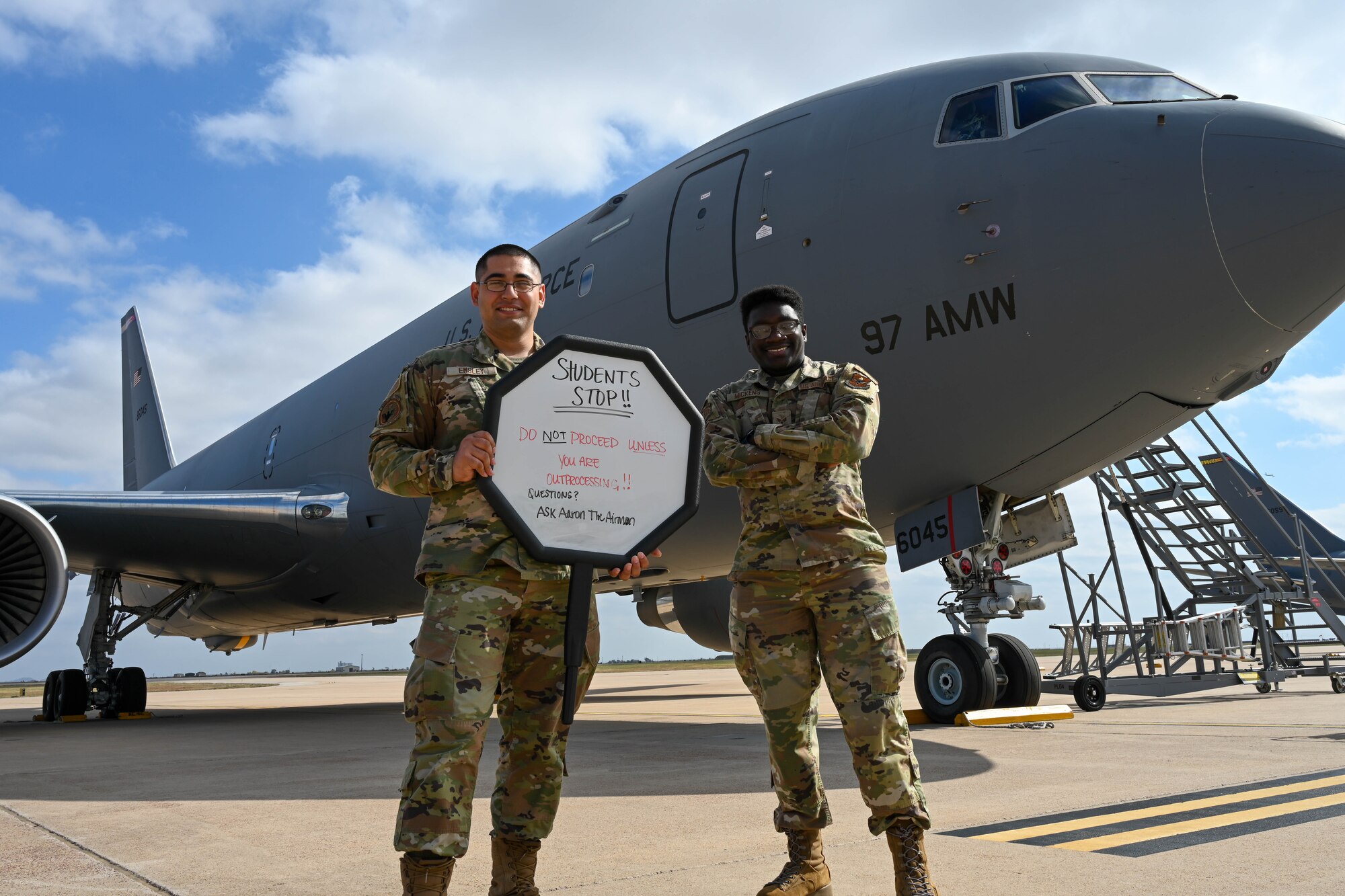 Airman 1st Class Aaron Emsley, 56th Air Refueling Squadron (ARS) Squadron Aviation Resource Management (SARM) journeyman, and Senior Airman Avion Mickens, 56th ARS SARM non-commissioned officer in charge, pose for a photo at Altus Air Force Base, Oklahoma, Nov. 3, 2022.SARM Airmen train to be multi disciplined, including scheduling, use of military radios and other aircrew responsibilities, to perform their duties at home station and on deployments. (U.S. Air Force photo by Senior Airman Trenton Jancze)