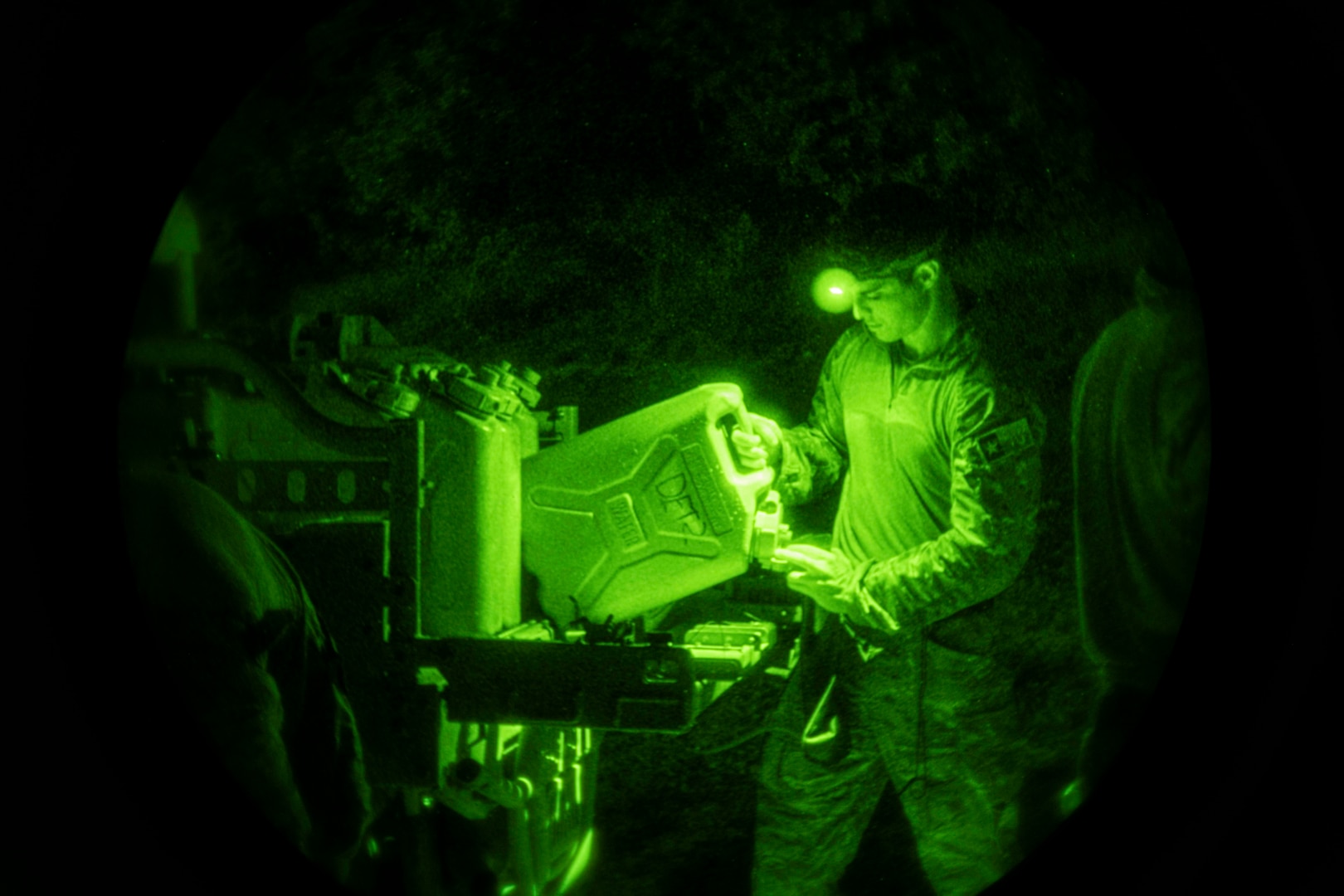 U.S. Air Force Tactical Air Control Party (TACP) specialist fills up his water canister before starting the land navigation portion of the 2022 Lightning Challenge Joint Base San Antonio-Camp Bullis, Texas, Nov. 3, 2022. Lightning Challenge tests United States Air Force TACP Airmen through competition in agile combat employment, physical ability and marksmanship in order to identify the most outstanding multi-capable Airman in the world, prepared to fight and win on the all-domain battlefields of the future. (U.S. Air Force photo by Tristin English)