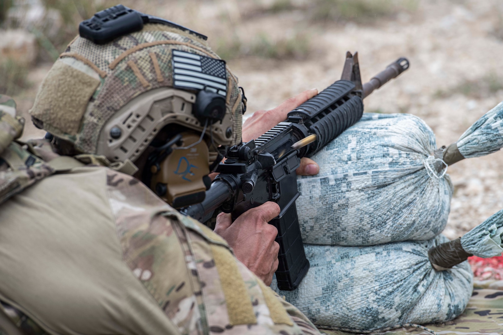 A U.S. Air Force Tactical Air Control Party (TACP) specialist fires his weapon to hit targets during the TACP 2022 Lightning Challenge at Joint Base San Antonio-Camp Bullis, Texas, Nov. 4, 2022. Lightning Challenge tests United States Air Force TACP Airmen through competition in agile combat employment, physical ability and marksmanship in order to identify the most outstanding multi-capable Airman in the world, prepared to fight and win on the all-domain battlefields of the future. (U.S. Air Force photo by Tristin English)