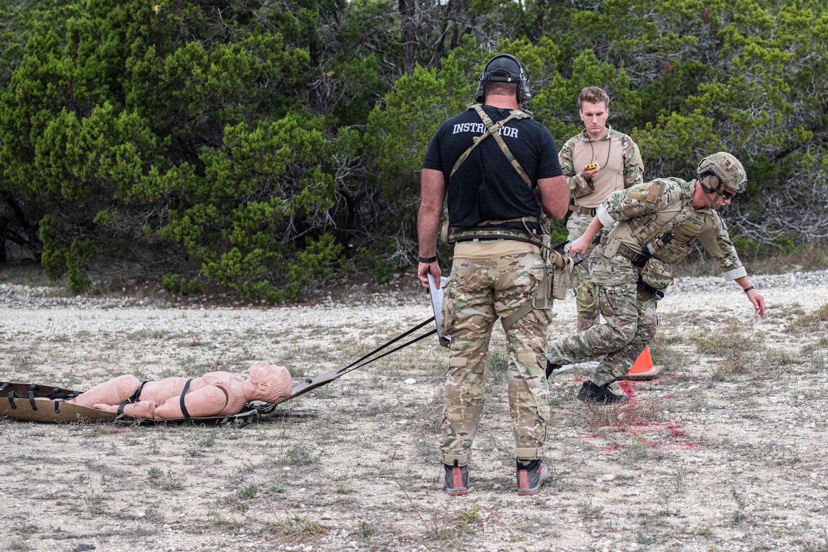 A U.S. Air Force Tactical Air Control Party (TACP) specialist executes a casualty evacuation exercise during the TACP Lightning Challenge 2022, at Joint Base San Antonio-Camp Bullis, Texas, Nov. 4, 2022. Lightning Challenge tests United States Air Force TACP Airmen through competition in agile combat employment, physical ability and marksmanship in order to identify the most outstanding multi-capable Airman in the world, prepared to fight and win on the all-domain battlefields of the future. (U.S. Air Force photo by Tristin English)