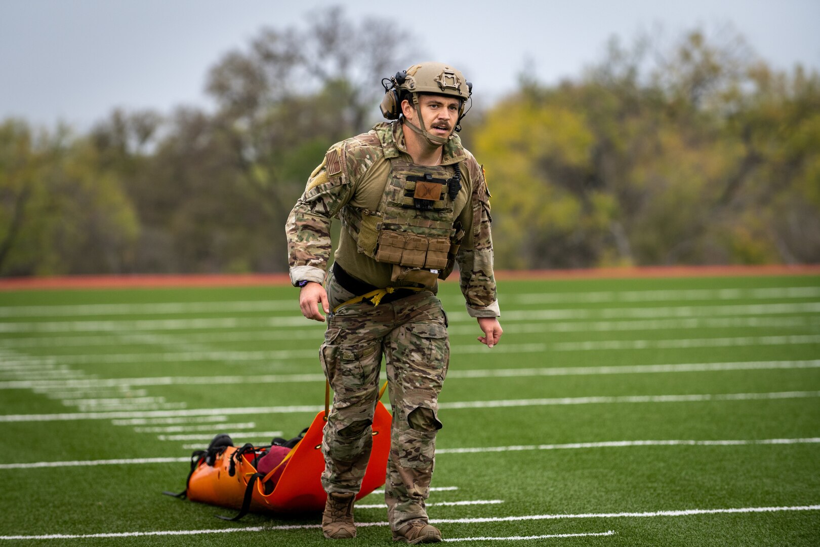 A Tactical Air Control Party Airman executes a casualty evacuation exercise during Lightning Challenge 2022, at Joint Base San Antonio-Chapman Annex, Texas, Nov. 3, 2022. The Lightning Challenge is an annual service-level TACP competition to identify the best TACP Airmen in the Air Force.