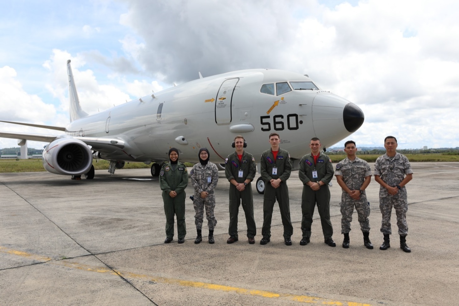 221025-N-FY142-0010 RIMBA AIR BASE, Brunei (Oct. 25, 2022) –  Members of Combat Aircrew 9, assigned to the “Red Lancers” of Patrol Squadron (VP) 10, pose for a photo in front of a static display with members of the Royal Brunei Armed Forces during Cooperation Afloat Readiness and Training Brunei 2022. VP-10 is currently operating from Kadena Air Base in Okinawa, Japan. The squadron conducts maritime patrol and reconnaissance, as well as theater outreach operations, as part of a rotational deployment to the U.S. 7th Fleet area of operations. (U.S. Navy photo by Aviation Electrician’s Mate 1st Class Brian Woodford)