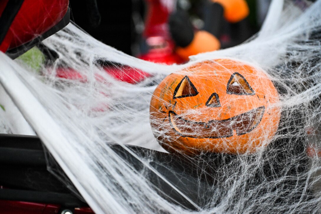 A Jack-o-lantern is displayed on top of a scooter at the Trunk or Treat event at Incirlik Air Base, Turkey, Oct. 29, 2022.