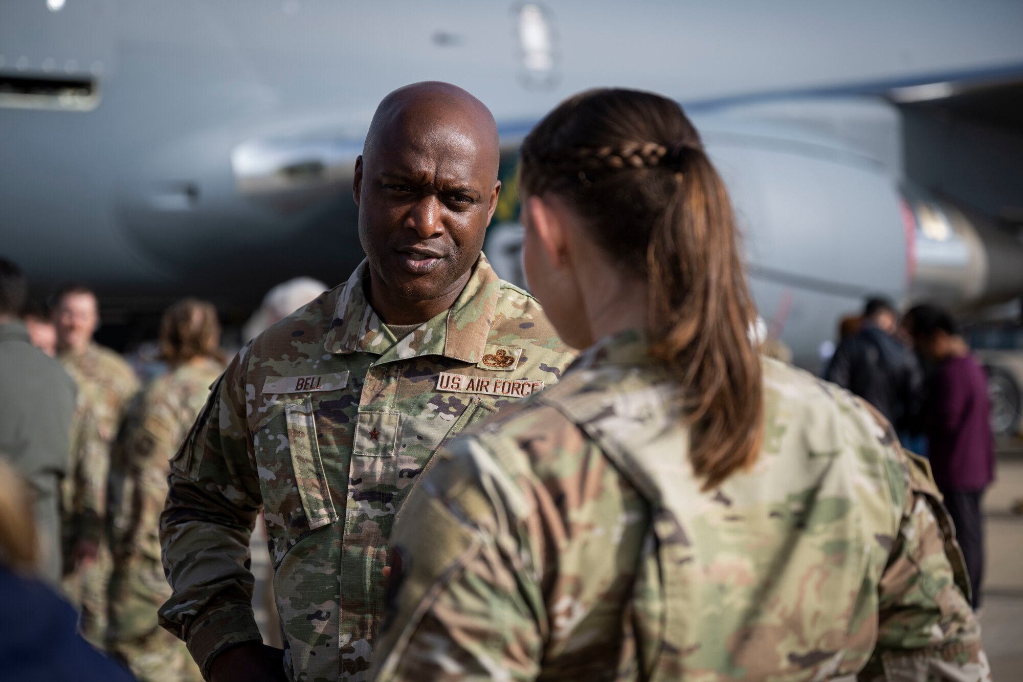 Brig. Gen. Kenyon Bell, Air Force Global Strike Command director of logistics and engineering, speaks with Airman 1st Class Triniti Marhafer, 334th Fighter Squadron command support section apprentice, during Strive 4th: A Project Tuskegee and aviation inspiration mentorship initiative at Seymour Johnson Air Force Base, North Carolina, Nov. 4, 2022. Project Tuskegee aims to expose men and women to the many opportunities within AFGSC, to reinforce the historical connection between the Tuskegee Airmen and AFGSC, and to create a culture of unity that welcomes talent from all walks of life to the U.S. Air Force.