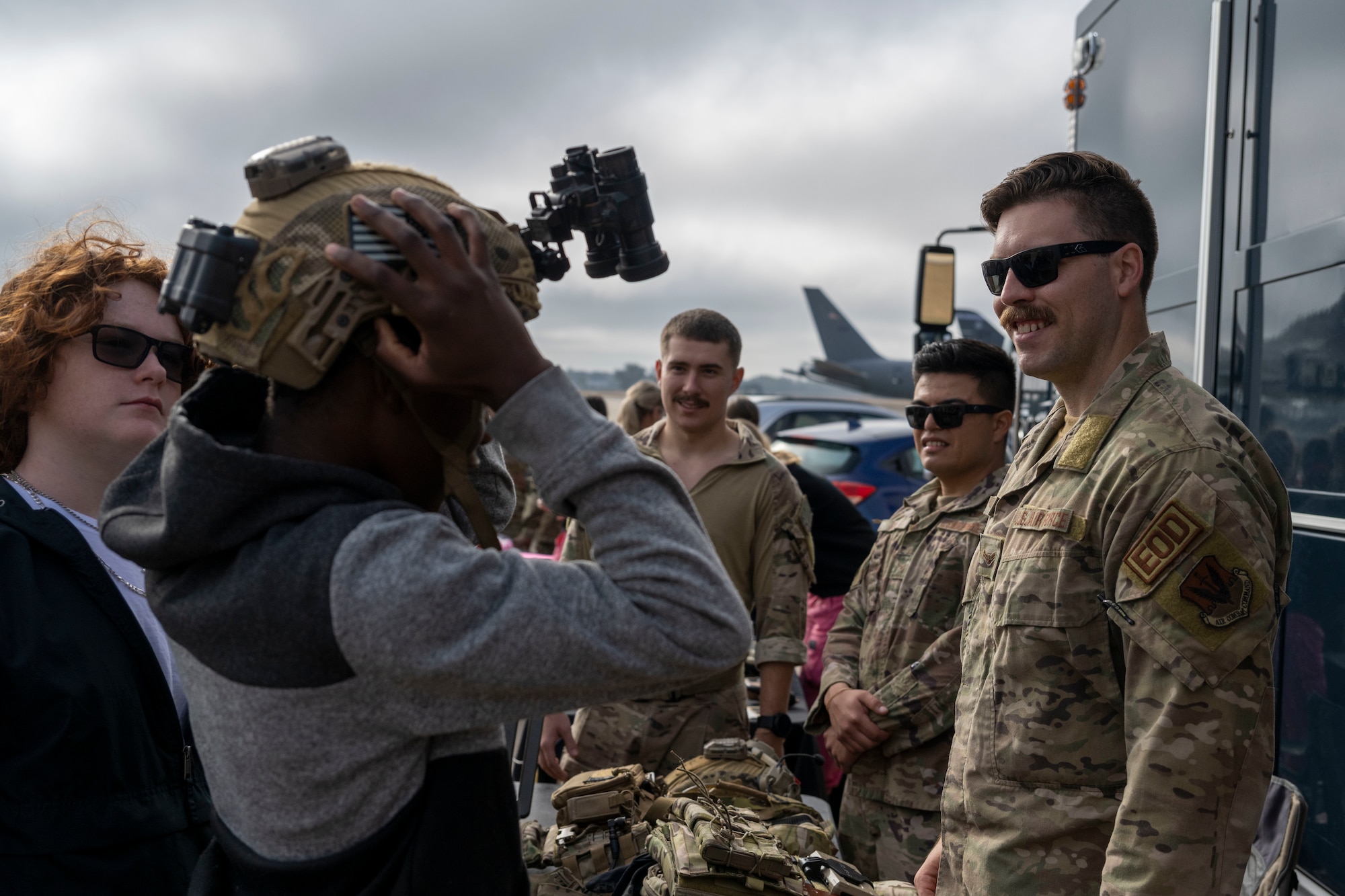 Airman 1st Class Jacob Gorrell, 4th Civil Engineer Squadron explosive ordnance disposal technician, talks to students from Rosewood High School about equipment used by EOD during Strive 4th: A Project Tuskegee and aviation inspiration mentorship initiative at Seymour Johnson Air Force Base, North Carolina, Nov. 4, 2022.