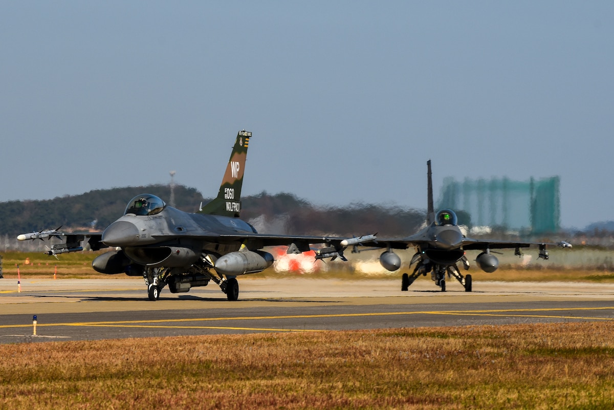 F-16 Fighting Falcons assigned to the 8th Operations Group taxi at Kunsan Air Base, Republic of Korea, Nov. 4, 2022. Kunsan launched 16 jets as a part of a Pacific Air Forces annual command sponsored Combined Flying Training Event, VIGILANT STORM 23, showcasing their ability to be ready to fight tonight. The training event allowed fourth and fifth-generation fighters to practice offensive and defensive tactics. (U.S. Air Force photo by Tech. Sgt. Timothy Dischinat)