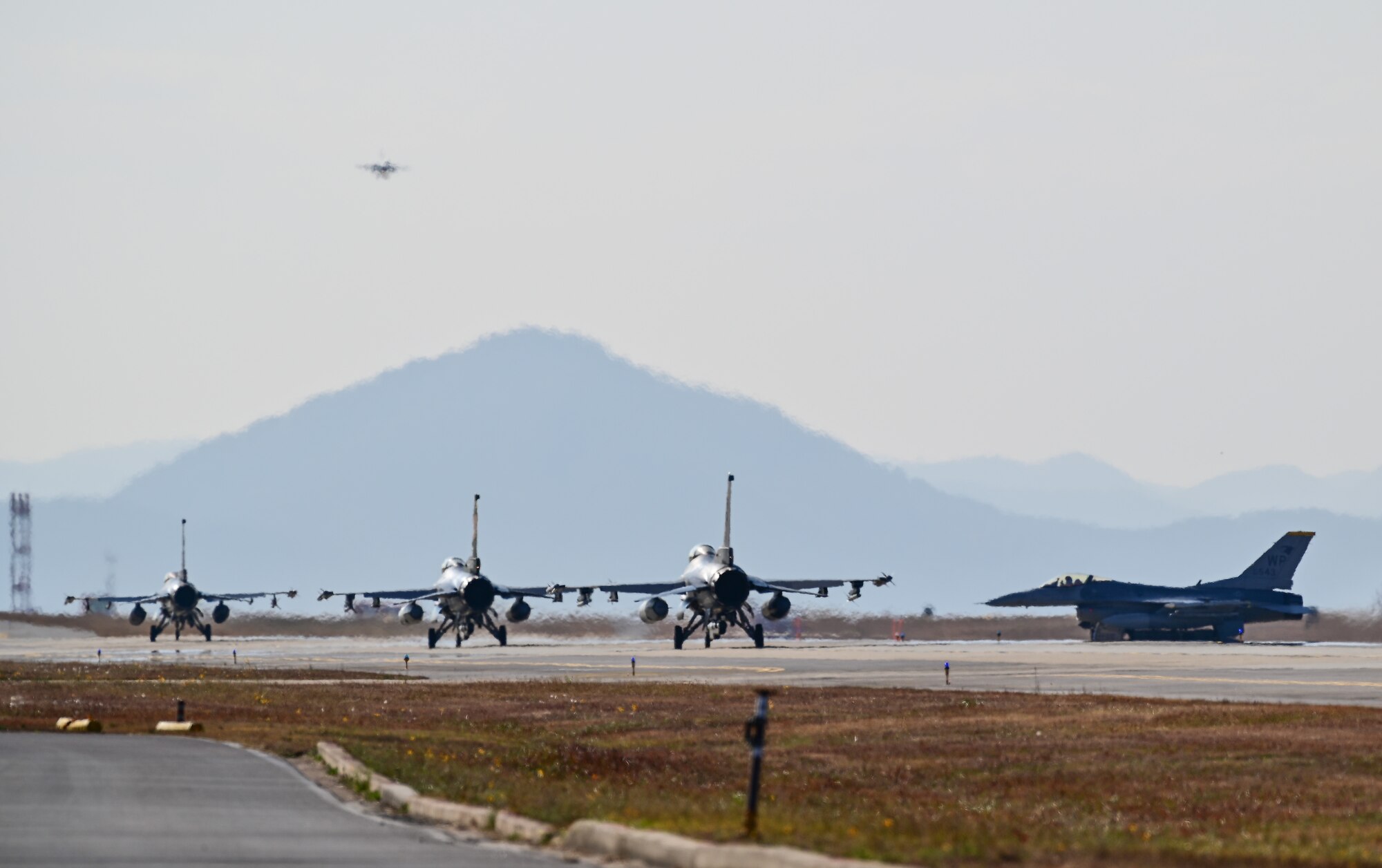 Four F-16 Fighting Falcons assigned to the 80th Fighter Squadron taxi at Kunsan Air Base, Republic of Korea, Nov. 4, 2022. Kunsan launched 16 jets as a part of a Pacific Air Forces annual command sponsored Combined Flying Training Event, VIGILANT STORM 23, showcasing their ability to remain ready to fight tonight. The training event allowed fourth and fifth-generation fighters to practice offensive and defensive tactics. (U.S. Air Force photo by Staff Sgt. Sadie Colbert)