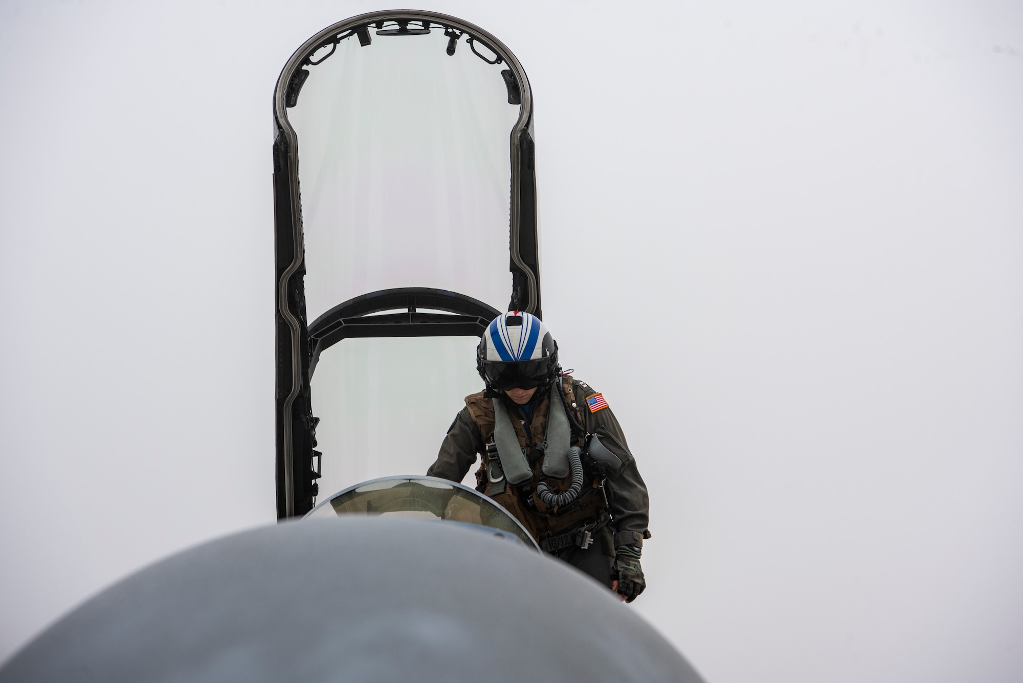 U.S. Navy Lt. Nick Lasalle, pilot assigned to Electronic Attack Squadron 131 at Naval Air Station Whidbey Island, Washington, climbs into an EA-18G Growler during Vigilant Storm 23 at Osan Air Base, Republic of Korea, Nov. 1, 2022.