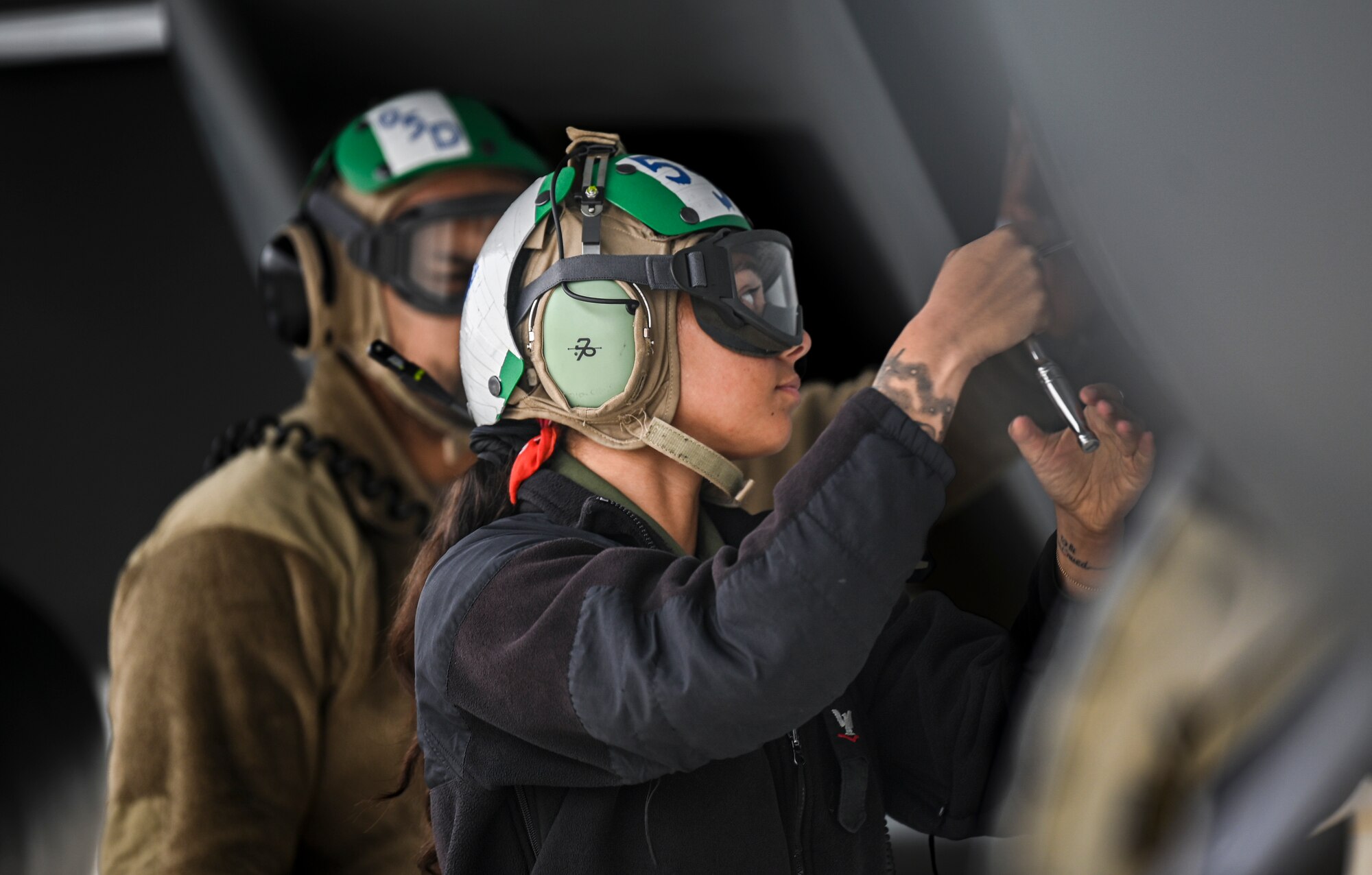 U.S. Navy Petty Officer 3rd Class Alexus Tesi, aviation mechanist mate assigned to Electronic Attack Squadron 131 at Naval Air Station Whidbey Island, Washington, perform preflight procedures on an EA-18G Growler during Vigilant Storm 23 at Osan Air Base, Republic of Korea, Nov. 1, 2022.