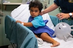 PUERTO BARRIOS, Guatemala (Oct. 29, 2022) Thiago Palencia, a two-year-old boy from Guatemala, waits outside of the operating room prior to his hand surgery aboard the hospital ship USNS Comfort (T-AH 20) off the coast of Puerto Barrios, Guatemala, Oct. 29, 2022. Comfort is deployed to U.S. 4th Fleet in support of Continuing Promise 2022, a humanitarian assistance and goodwill mission conducting direct medical care, expeditionary veterinary care, and subject matter expert exchanges with five partner nations in the Caribbean, Central and South America. (U.S. Navy photo by Mass Communication Specialist 2nd Class Juel Foster)