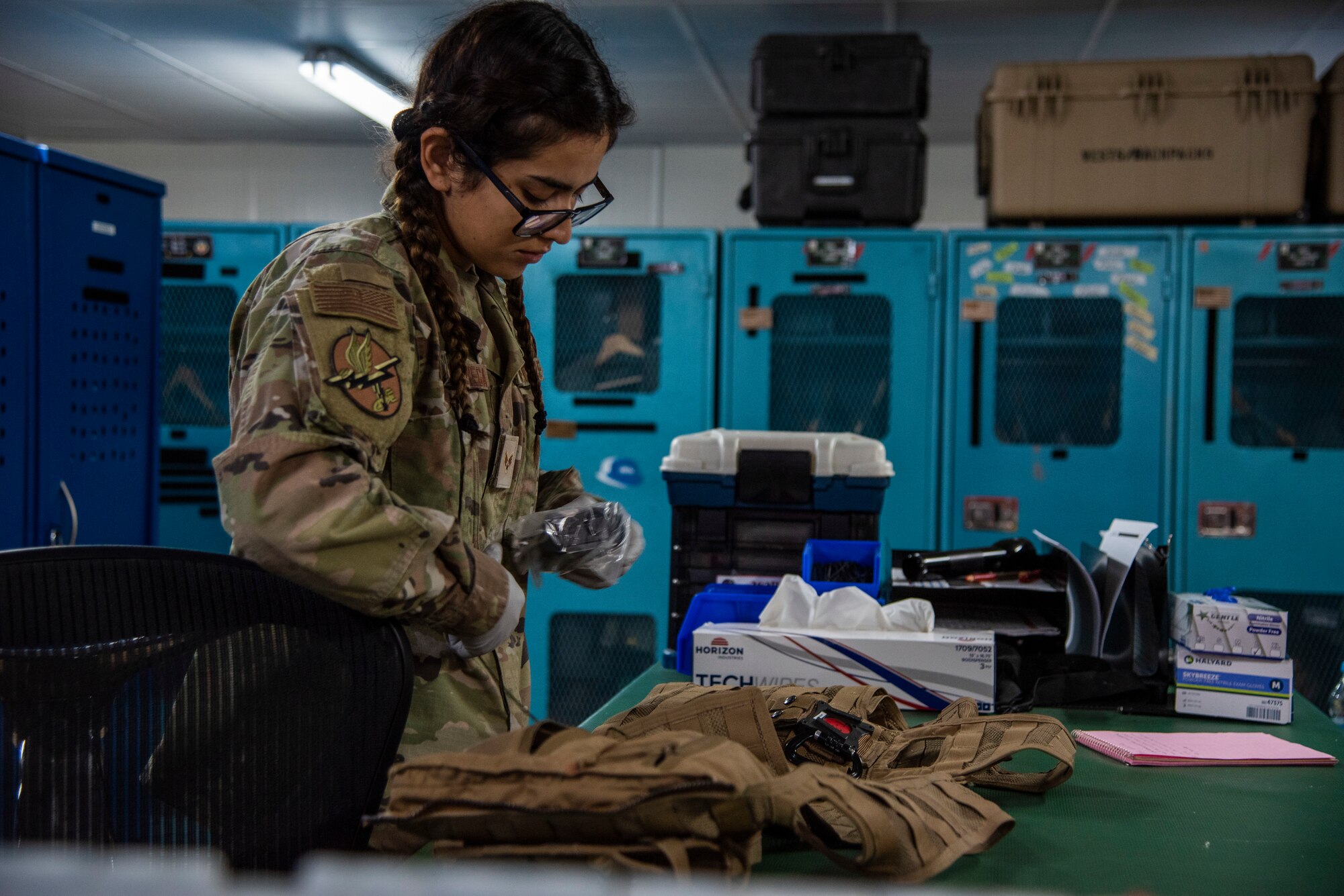 Senior Airman Kimberly Sanchez Vega performs preflight inspections and preparations on a G-suit at the 332d Air Expeditionary Operations Support Squadron Aircrew Flight Equipment facility at an undisclosed location, Southwest Asia, Oct. 29, 2022. Aircrew Flight Equipment personnel perform maintenance and upkeep for all equipment that pilots and other aircrew need to perform flight missions. (U.S. Air Force photo by: Tech. Sgt. Jim Bentley)