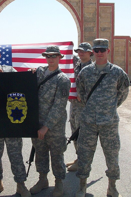 Derek Reigel (far right) on deployment to Iraq in 2008 with the U.S. Army Test, Measurement, and Diagnostic Equipment Activity team from Fort Lewis, Wash. Reigel spent 25 years on active duty in the Army. He now works for the USATA team at Corpus Christi Army Depot in southeast Texas, a subordinate element of the U.S. Army Aviation and Missile Command.
