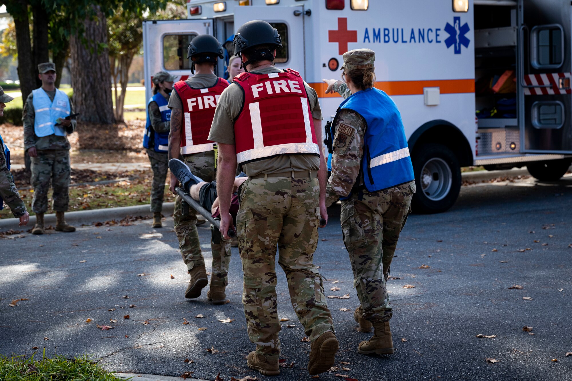 Airmen assigned to the 4th Fighter Wing carry a simulated patient during an active-shooter exercise at Seymour Johnson Air Force Base, North Carolina, Nov. 7, 2022. Active-shooter exercises test the readiness of base personnel’s response to certain situations.