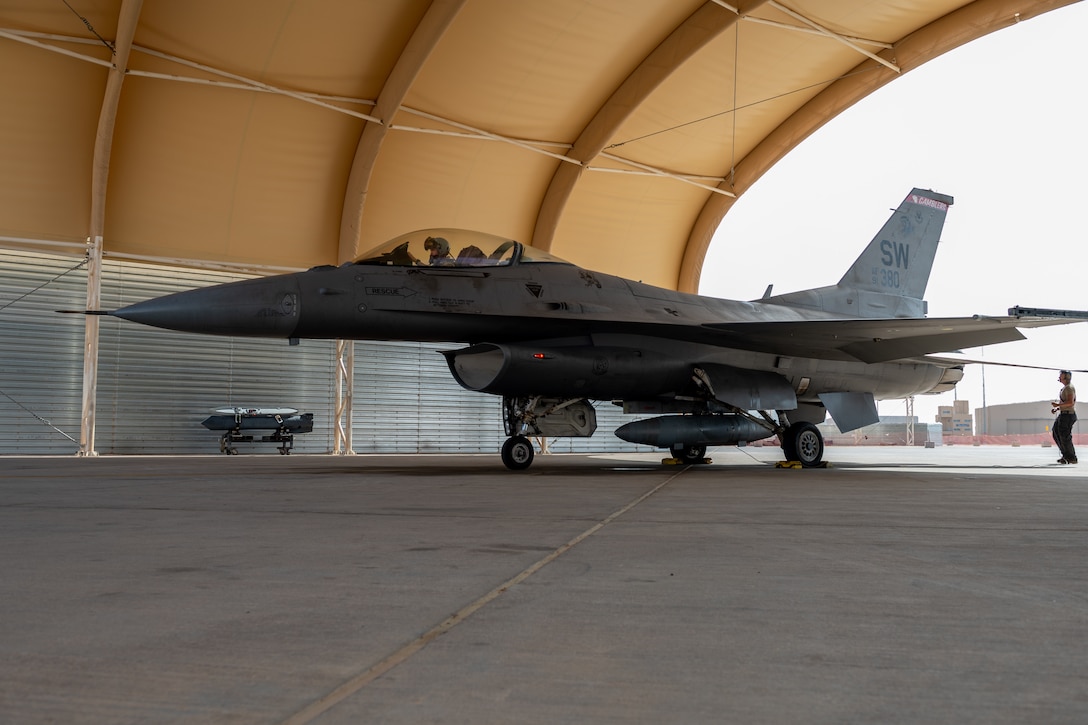 U.S. Air Force Capt. Christopher Hartman, a pilot assigned to the 77th Expeditionary Fighter Squadron, conducts pre-flight systems checks in the cockpit of an F-16 Fighting Falcon aircraft prior to departure for the Bahrain International Airshow (BAIS) 22, from Prince Sultan Air Base, Kingdom of Saudi Arabia, Nov. 6, 2022.  BAIS, a biennial event, is an opportunity to strengthen military-to-military relationships with regional partners and promote U.S. national security objectives in the U.S. Central Command area of responsibility. (U.S. Air Force photo by SSgt. Shannon Bowman)