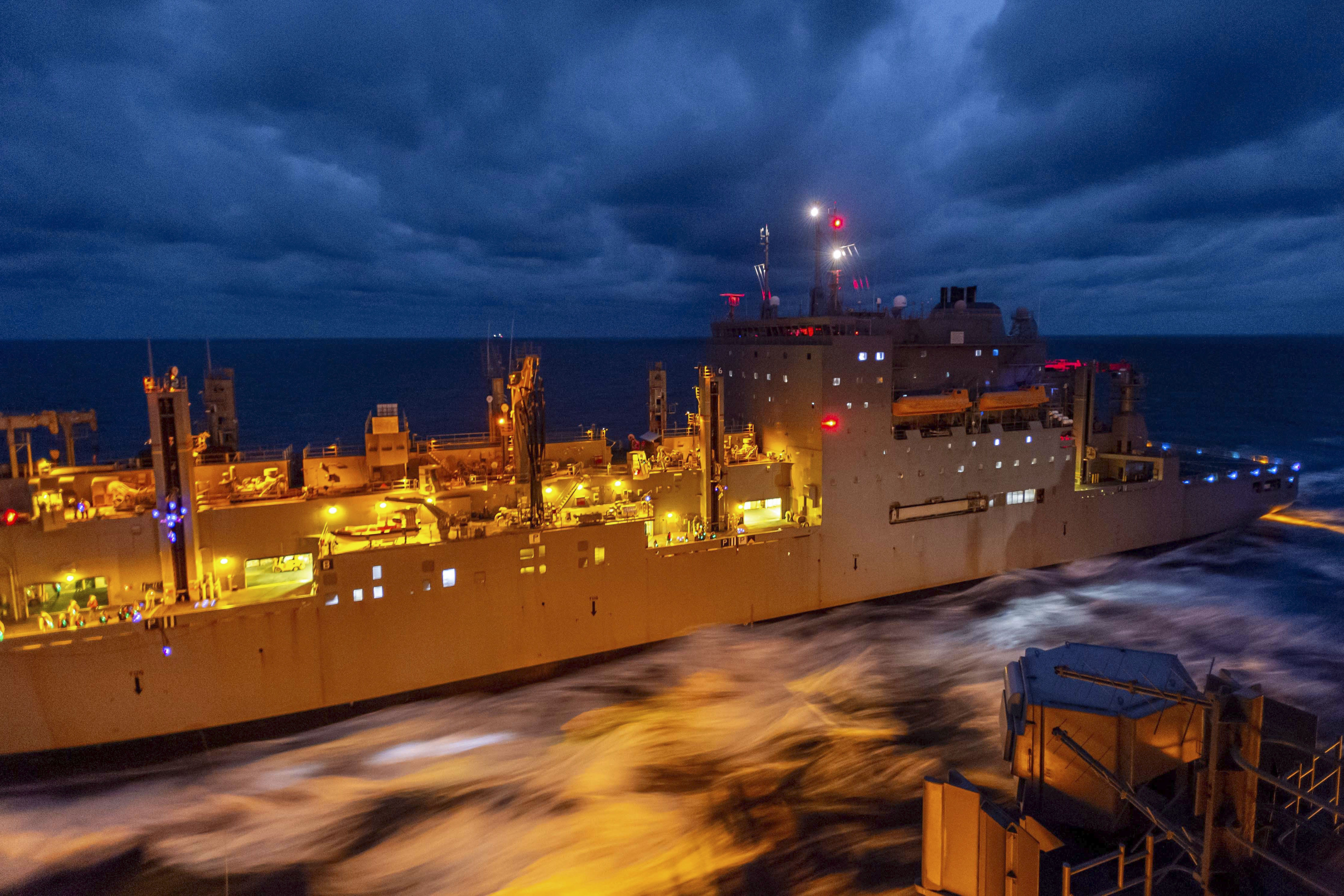 The USNS Carl Brashear and the USS Ronald Reagan conduct a replenishment in the Philippine Sea, Nov. 7, 2022.