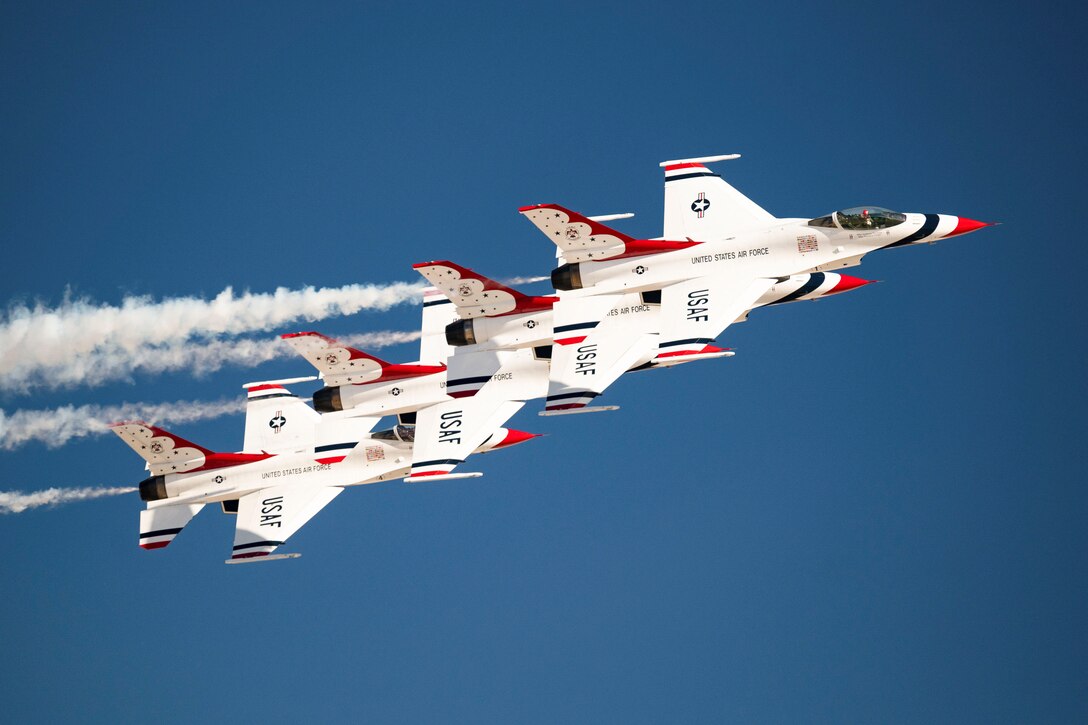 Four aircraft fly in formation.