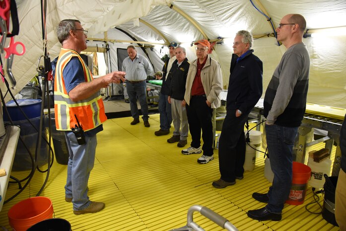 USACE employees and contractors visit a cleanup site on Redstone Arsenal during their quarterly RCWM meeting.