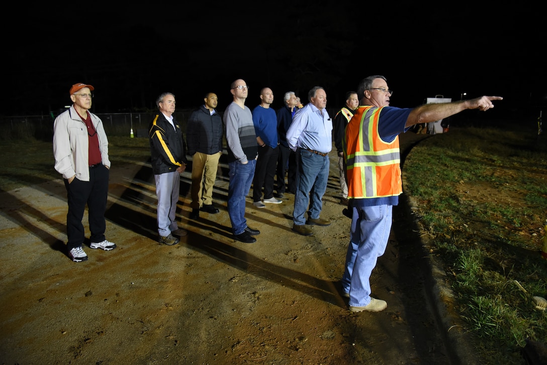 USACE employees and contractors visit a cleanup site on Redstone Arsenal during their quarterly RCWM meeting.