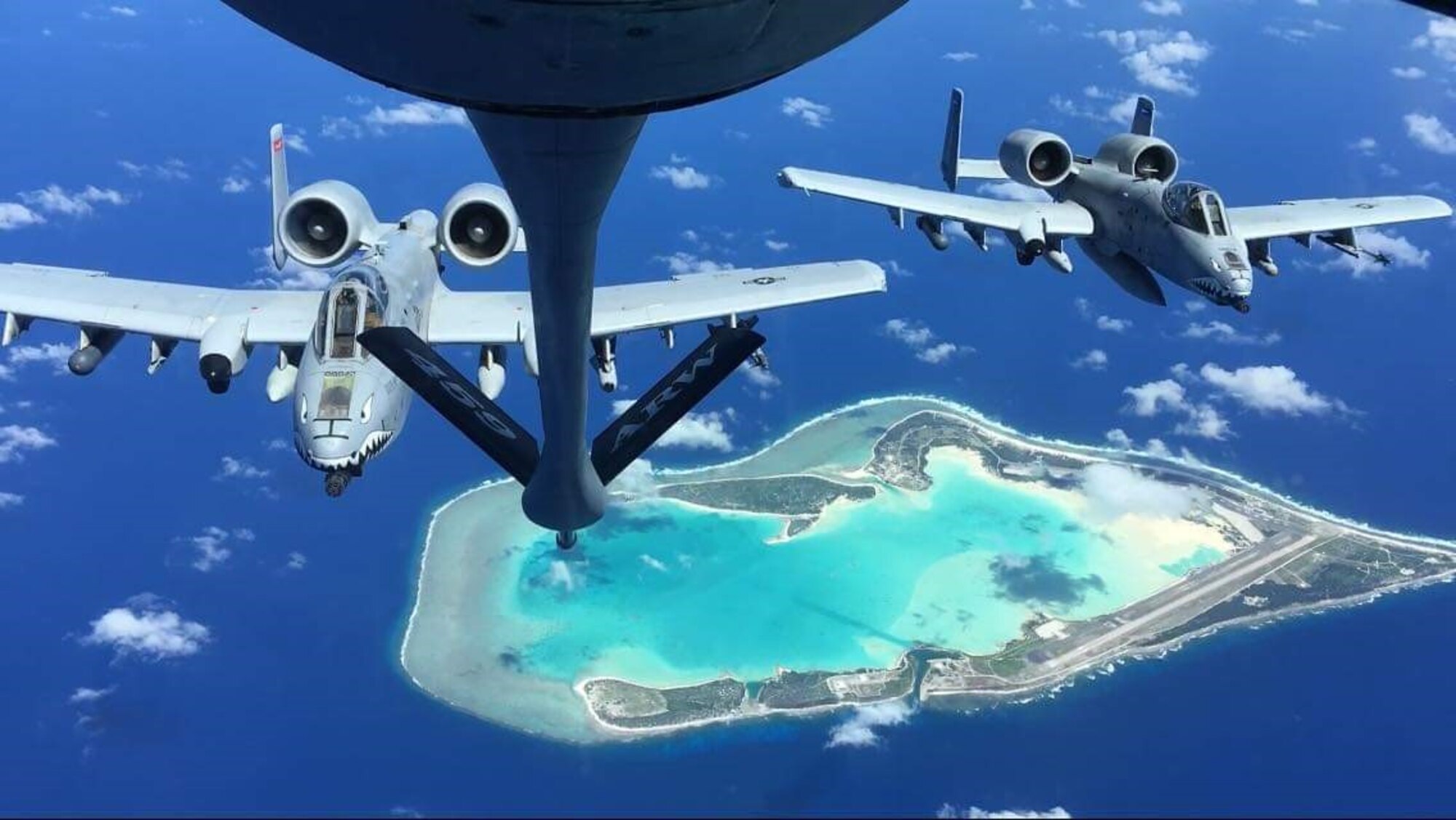 A KC-135 Stratotanker from the 459th Air Refueling Wing’s 756th Air Refueling Squadron trains with two 74th Fighter Squadron A-10C Thunderbolt II aircraft in air refueling missions over the Pacific Ocean on Oct. 23, 2022. The training mission took them over Wake Island pictured beneath the aircraft. Training missions with the Air Force inventory keep the flying skills and boom operations capabilities of the KC-135 air crews sharp. The training also provided all flyers the opportunity to participate in a Dynamic Force Employment exercise to maintain readiness in geographically separated and contested environments.